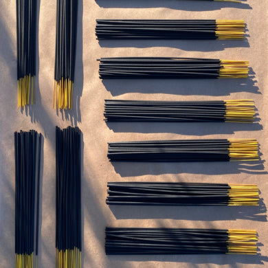 BUnches of stick incense in piles laying on a light tan surface ©Bloomwell