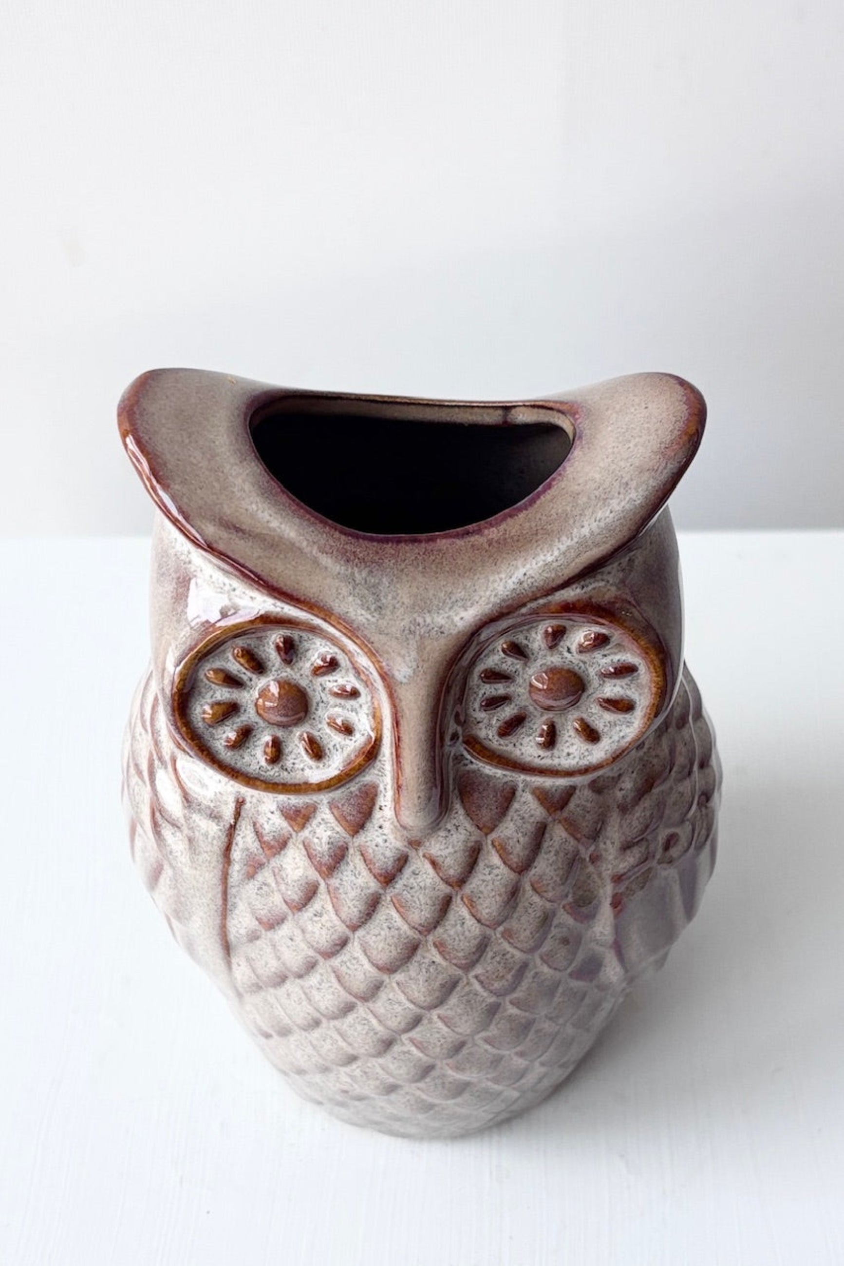 Top view of ceramic owl-shaped vase on a white background ©Sprout Home