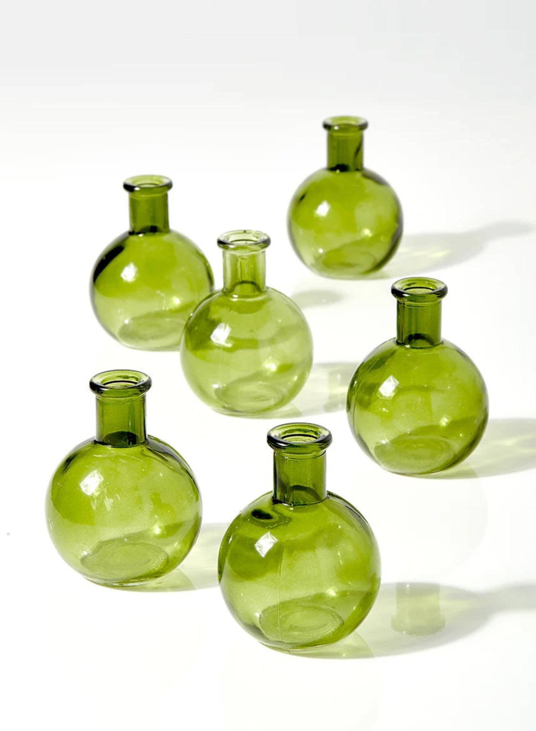 Set of green glass bottles on a white background ©jamaligarden