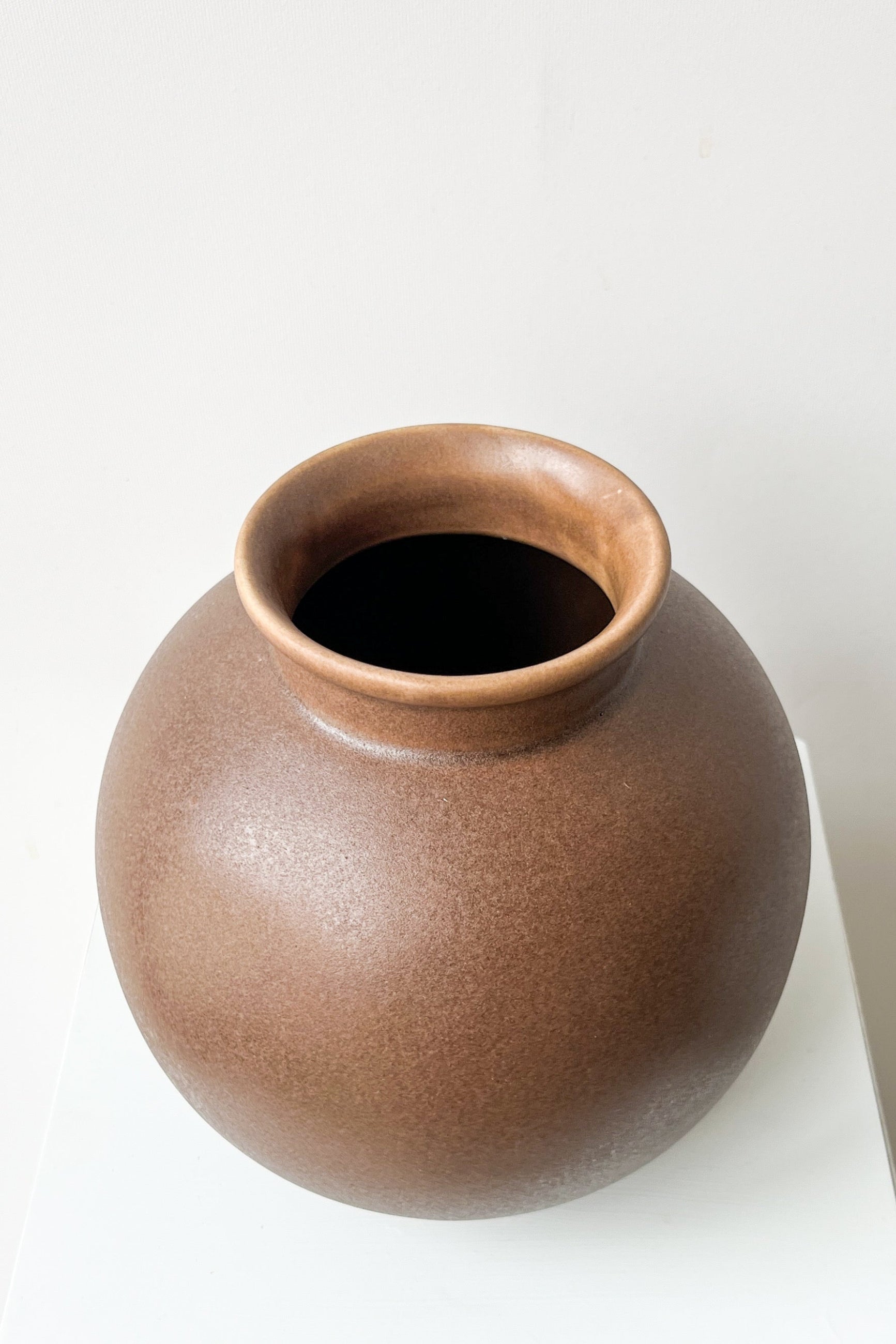 Brown ceramic vase on a white background ©Sprout Home