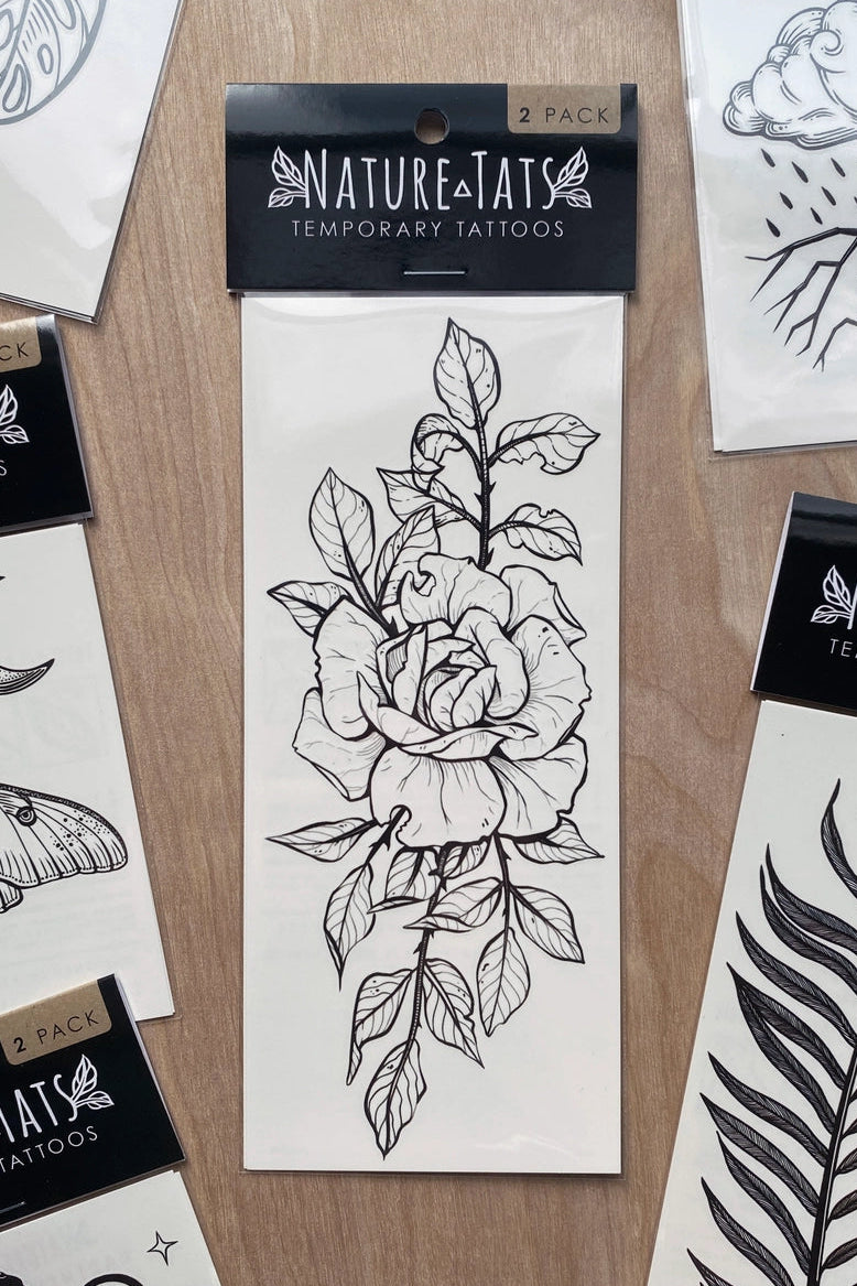 Nature-Tats temporary tattoos designs on a wooden surface. ©Nature Tats