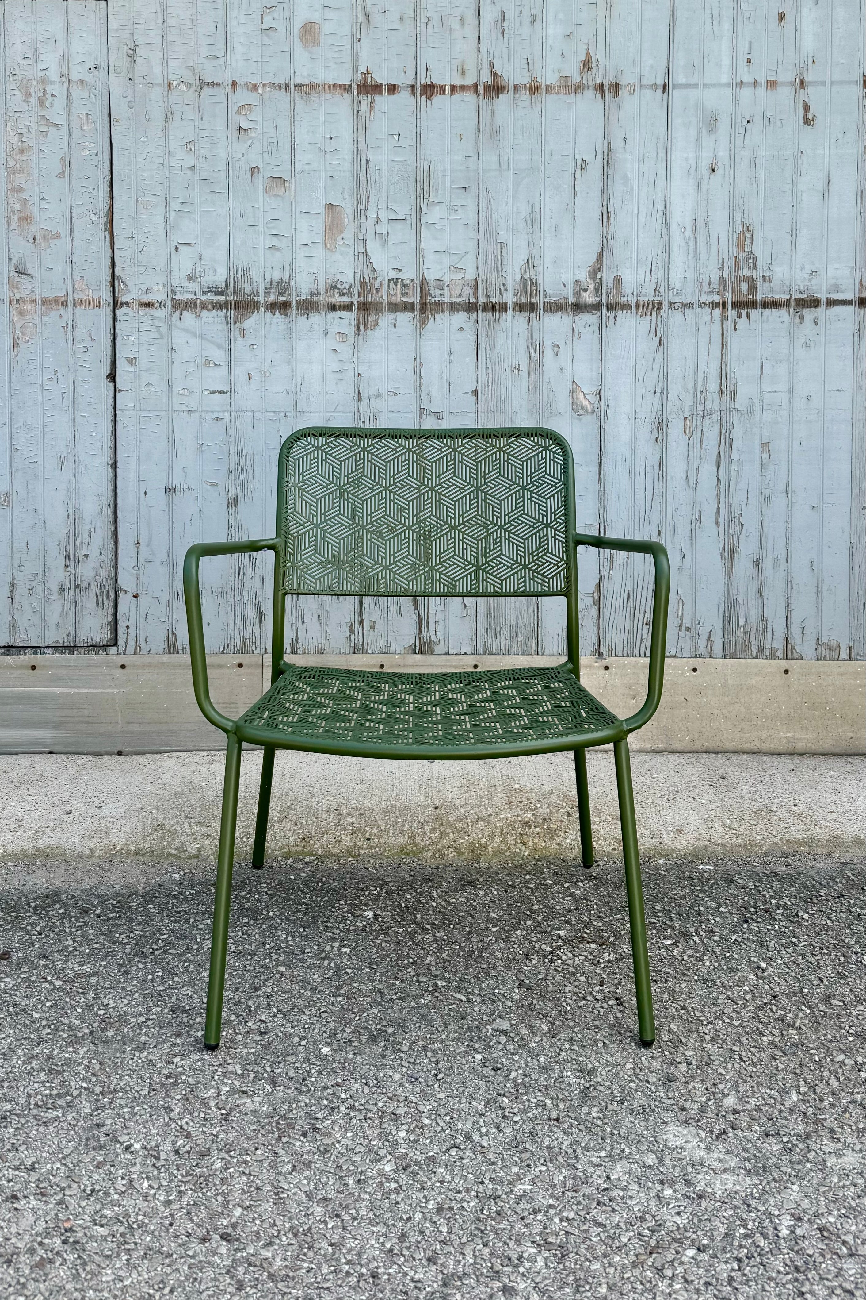 The green martini low profile chair viewed from the front at eye level.