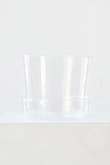 Glass planter against a white background