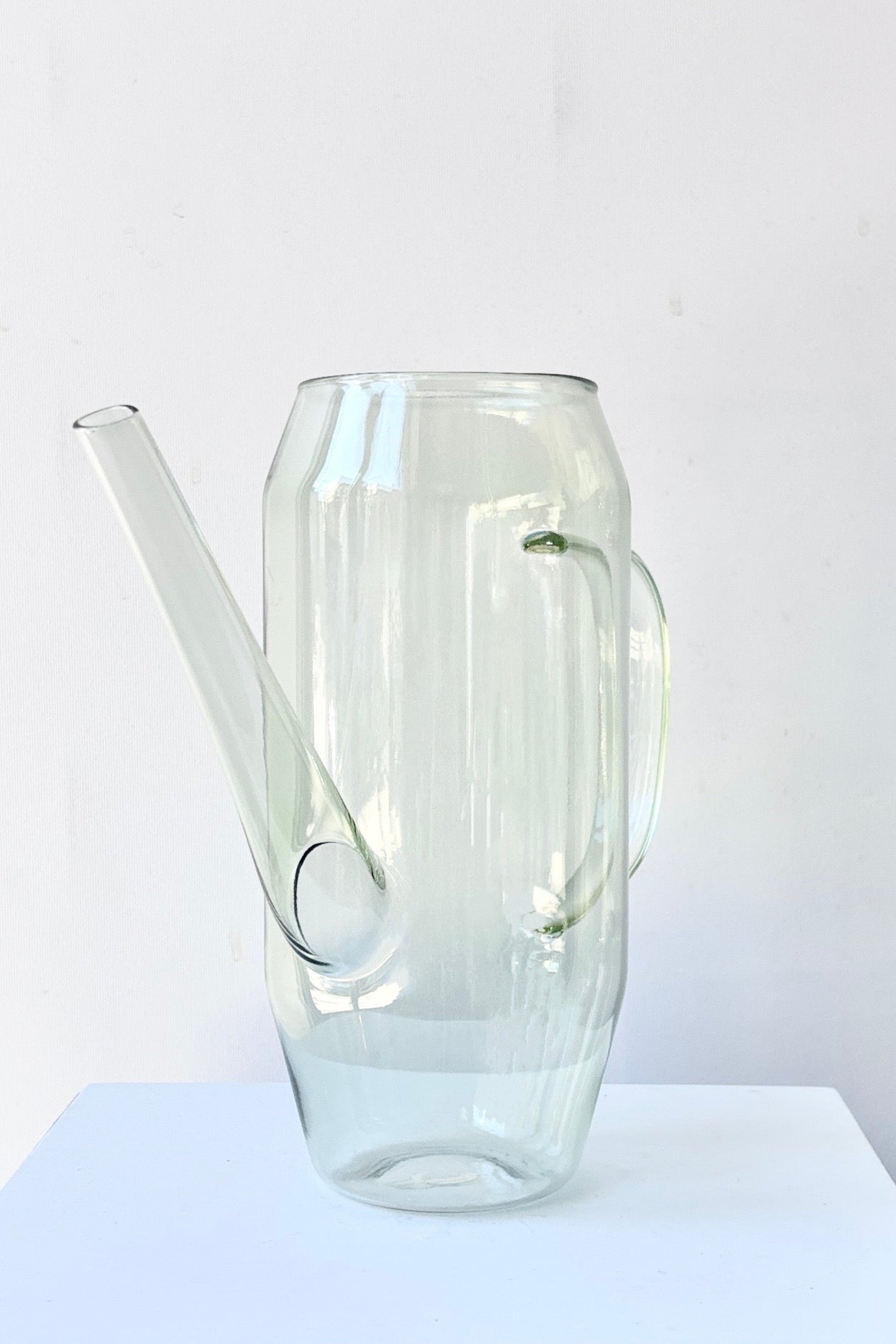 Clear glass Foray watering can against a white background ©Sprout Home