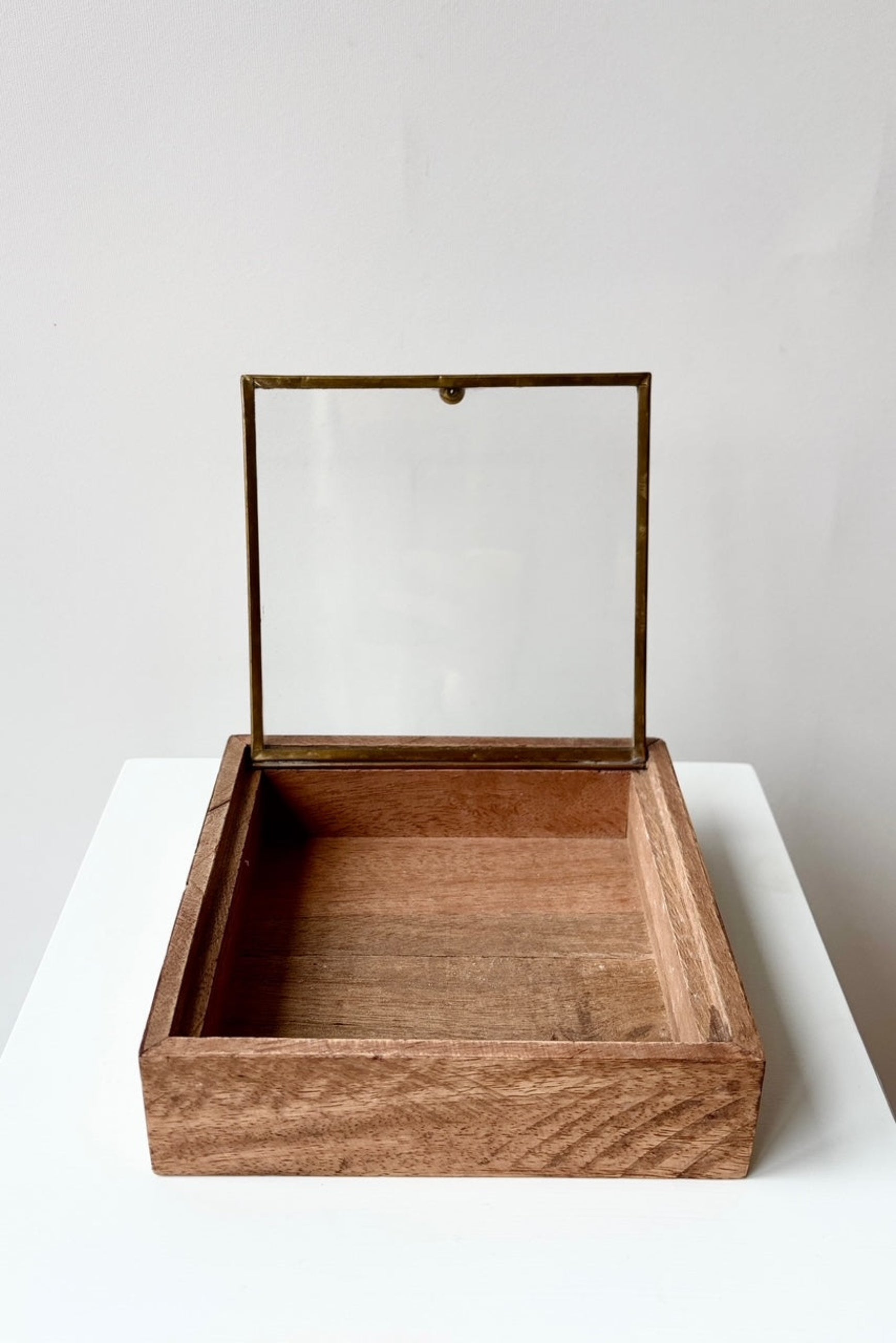 Sibella wood box medium with open glass lid displayed against a white wall ©Sprout Home