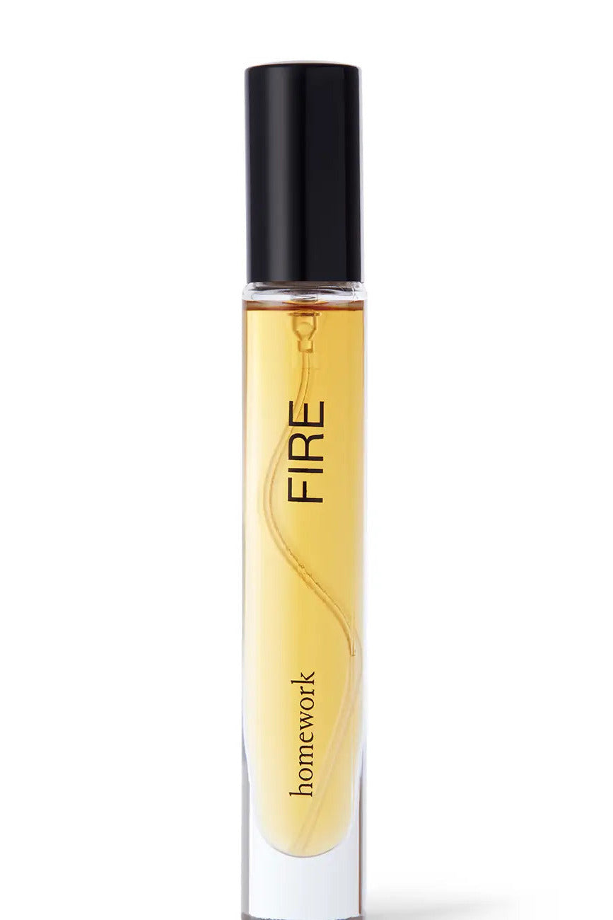 Perfume bottle labeled 'FIRE' by 'homework' on a white background ©Homework