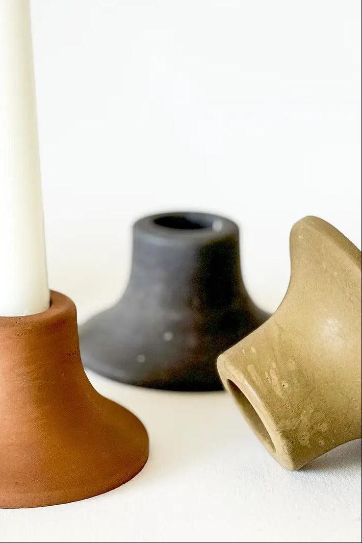 Set of ceramic candle holders in various colors on a white background ©Sunday Nomad