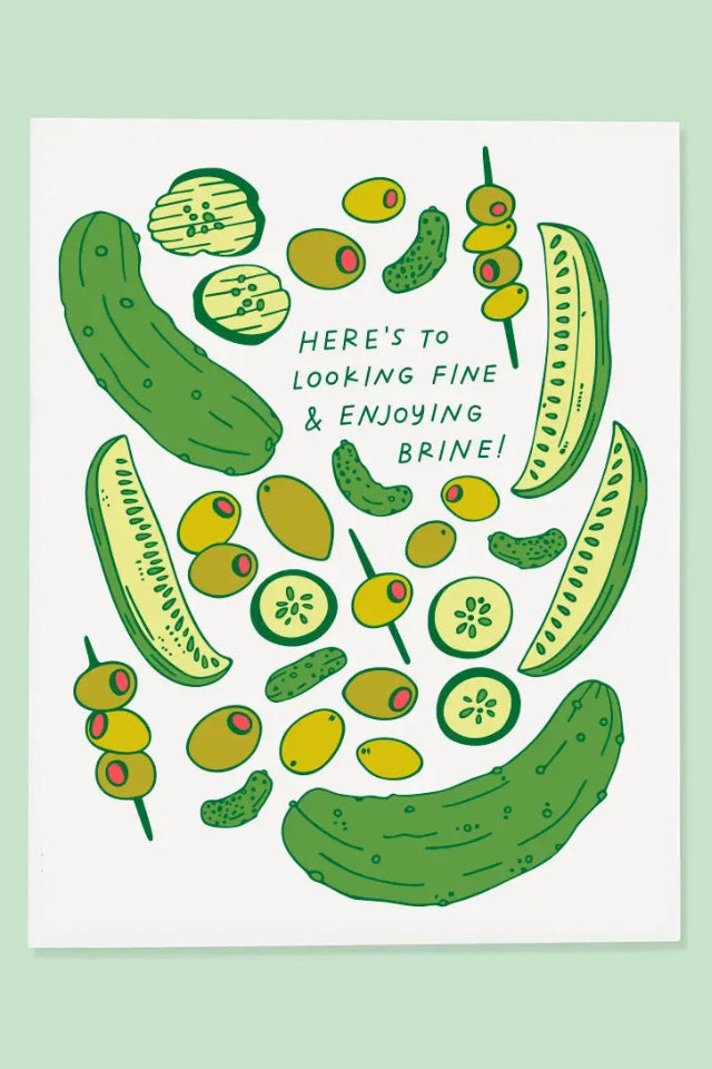 A green card with pickles and olives and the text "Here's to looking fine and enjoying brine!" ©The Good Twin