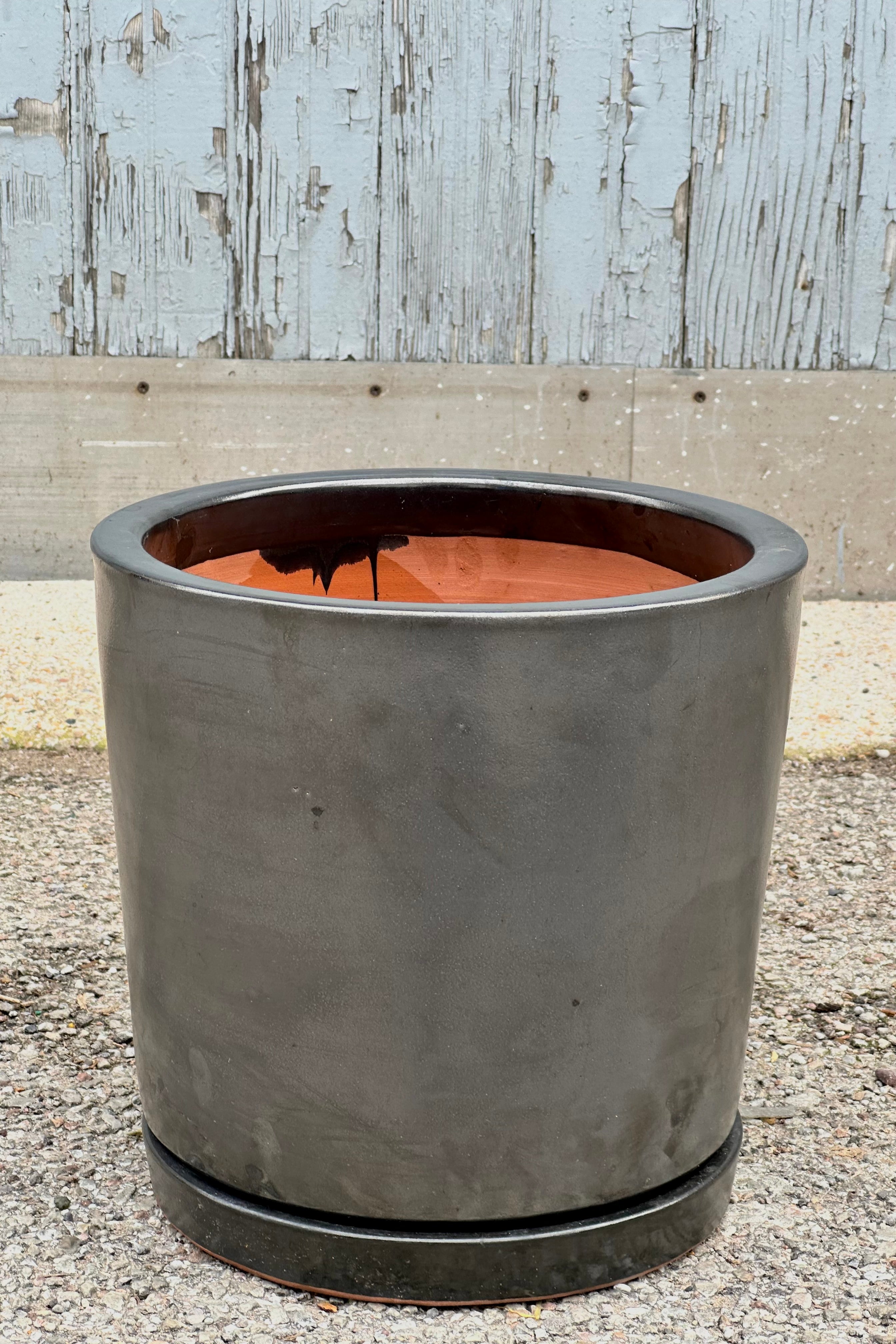 I/O2 planter and saucer in a graphite gray metallic finish at Sprout Home.