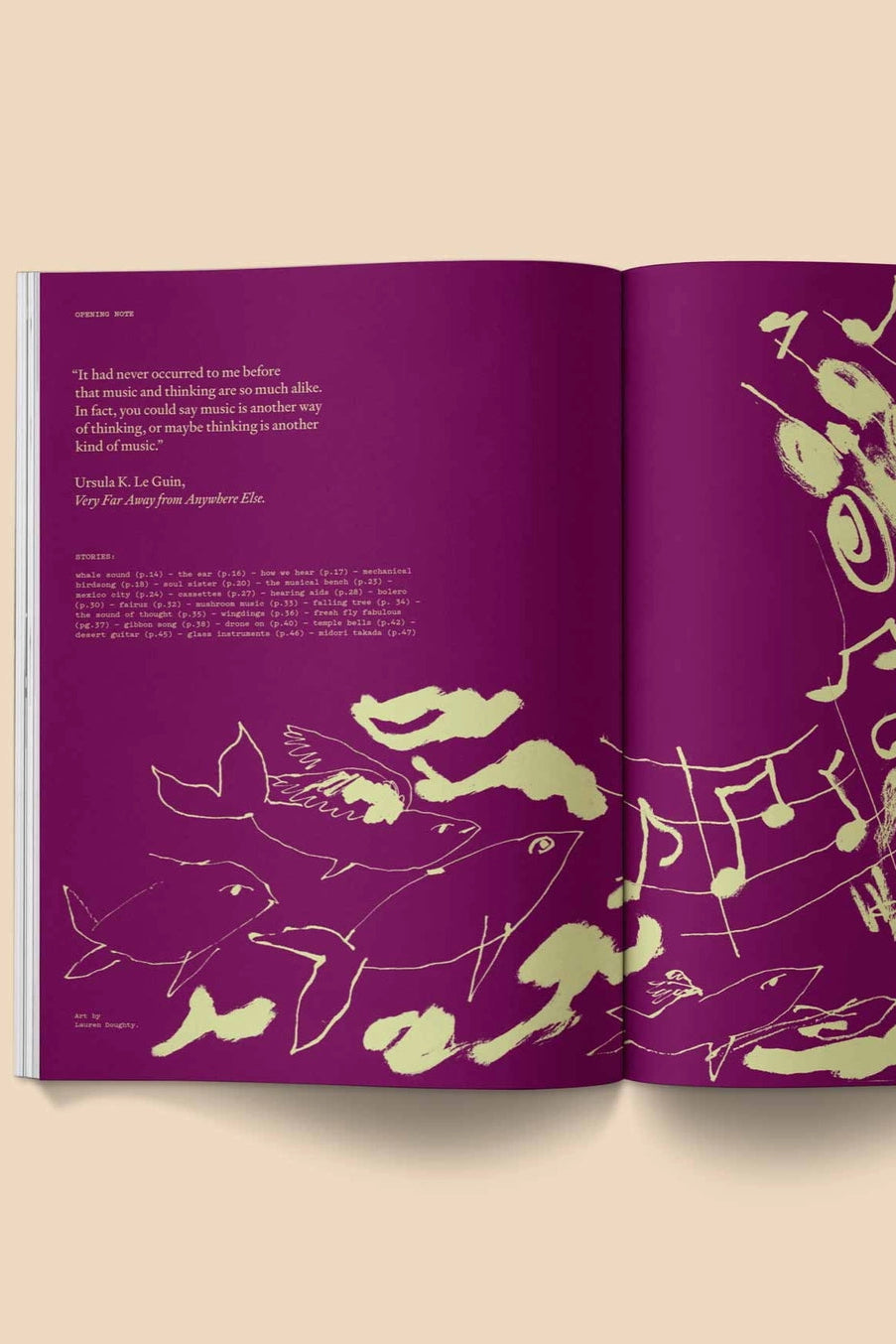 Heartbeat Magazine: Music, Sound, Emotion Open book with purple pages featuring white line art and musical notes on a beige background ©Broccoli