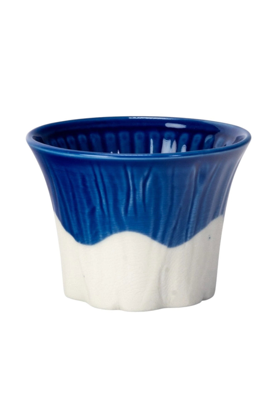 Ceramic cup with blue top and white bottom on a white background ©Urban Tokyo