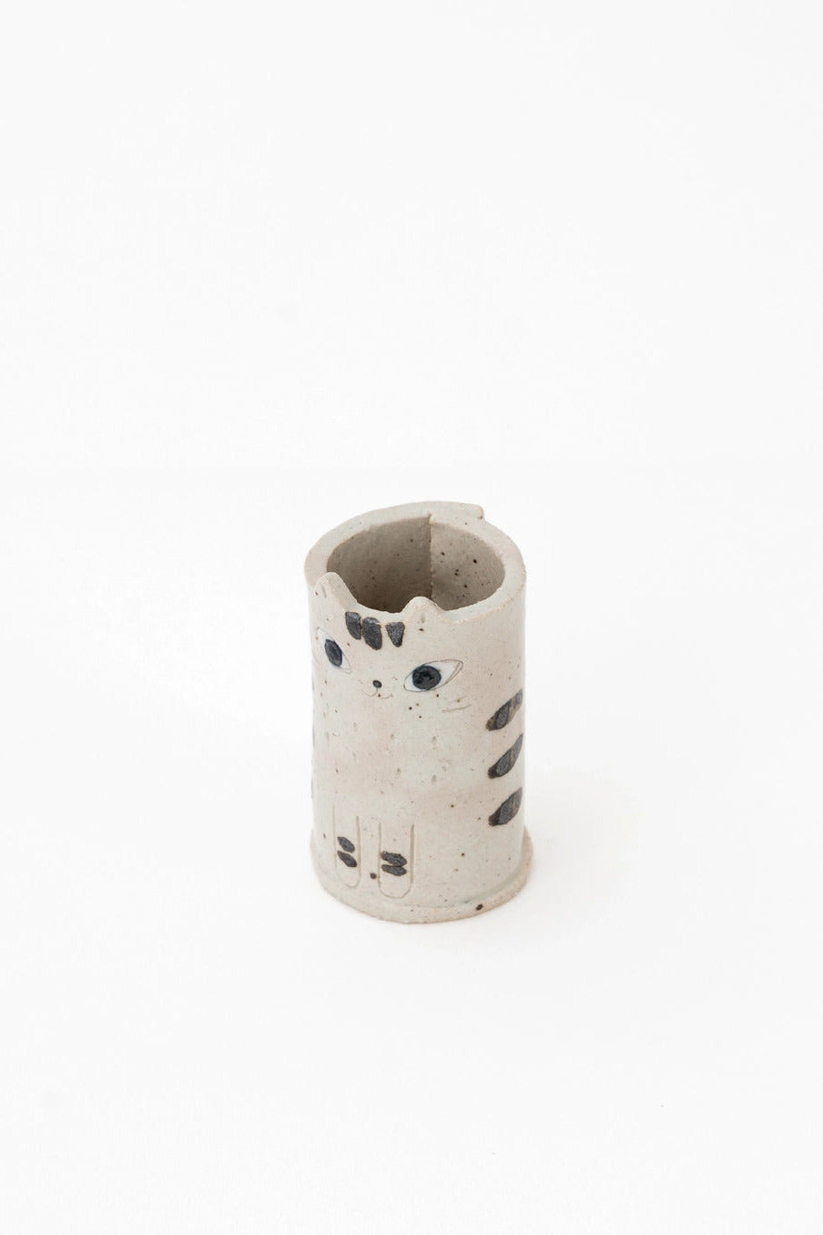 Cylindrical ceramic vase with cat design on a white background ©Great Zakka