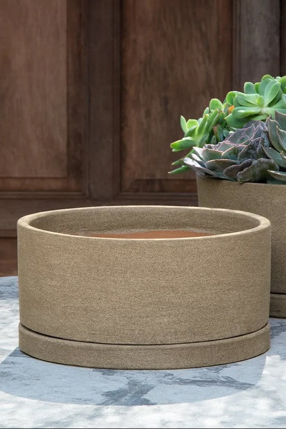 A low profile planter in front of a wooden wall ©Campania International