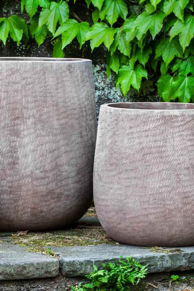 a medium and large antico handspum linen planters side by side.
