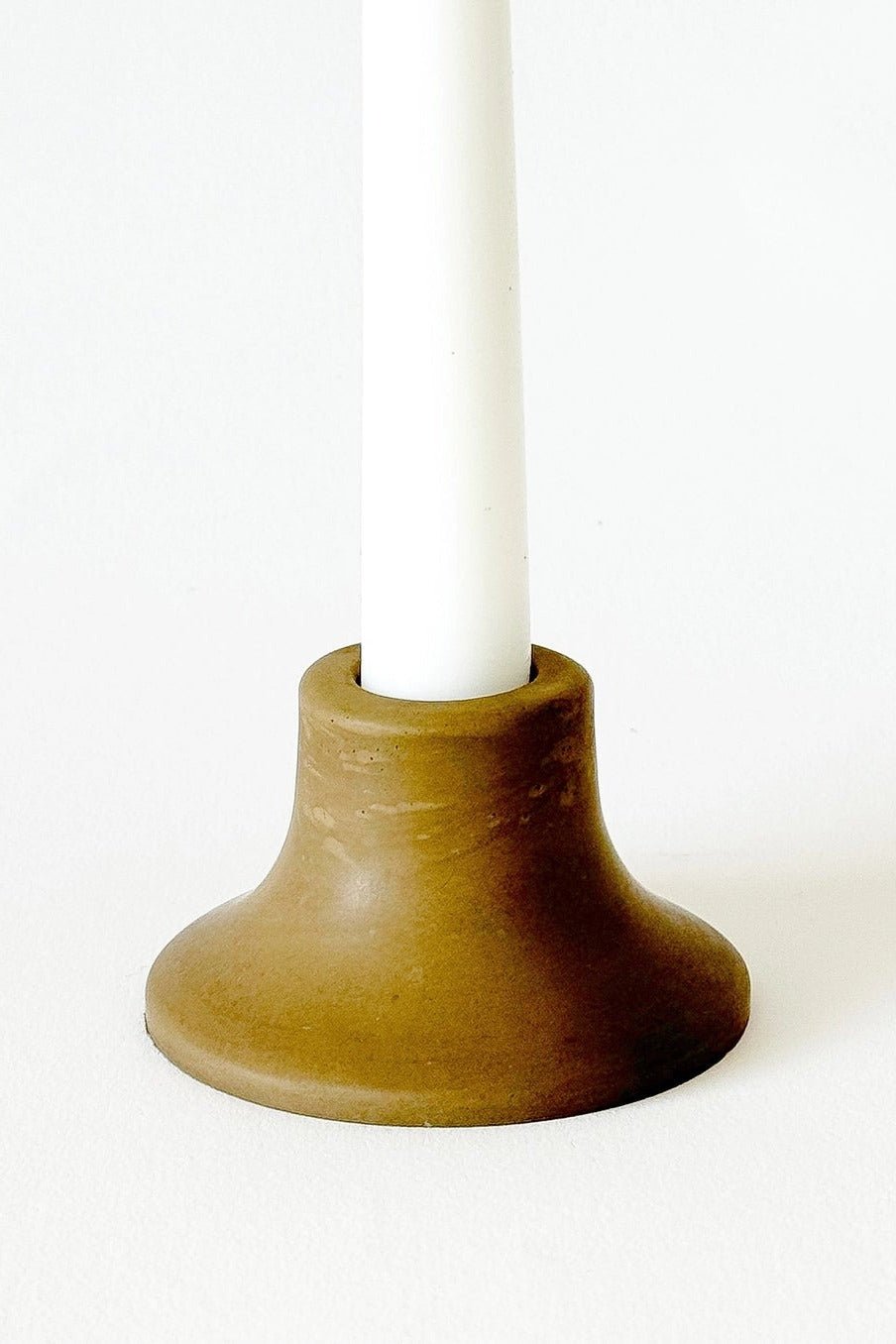 Mina Short Taper Candle Holder Olive with a white candle ©Sunday Nomad