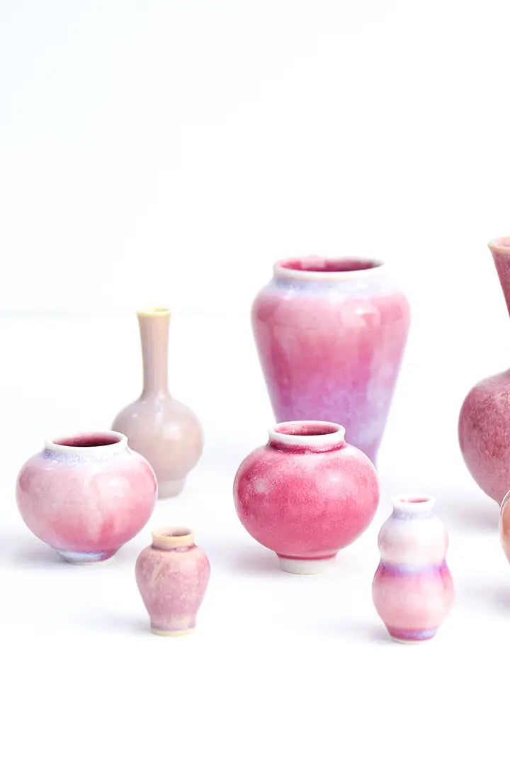 set of miniature pink vases on a white background ©SGW Labs