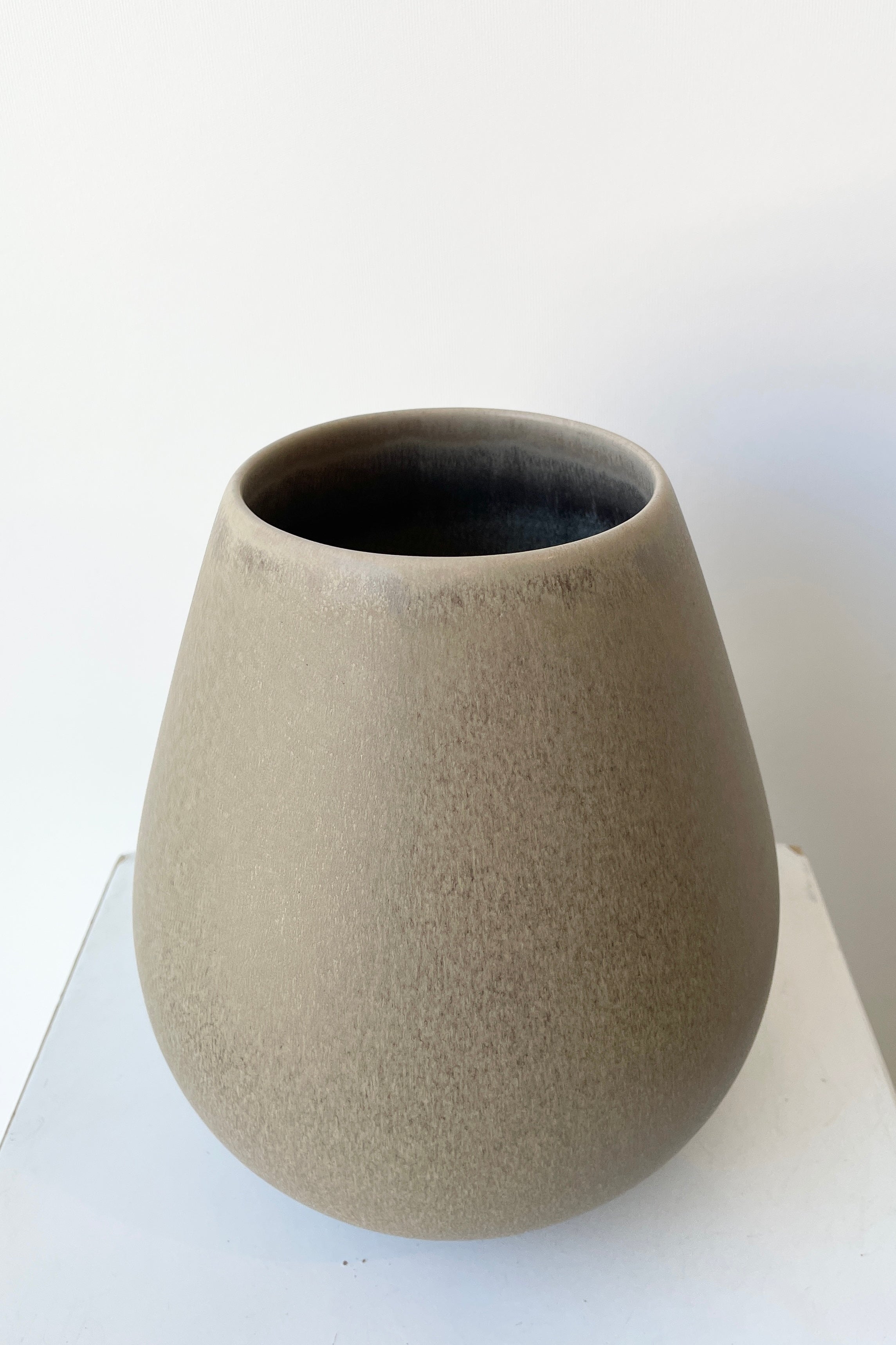 The Ease Round Vase in a Stone color viewed from topside.