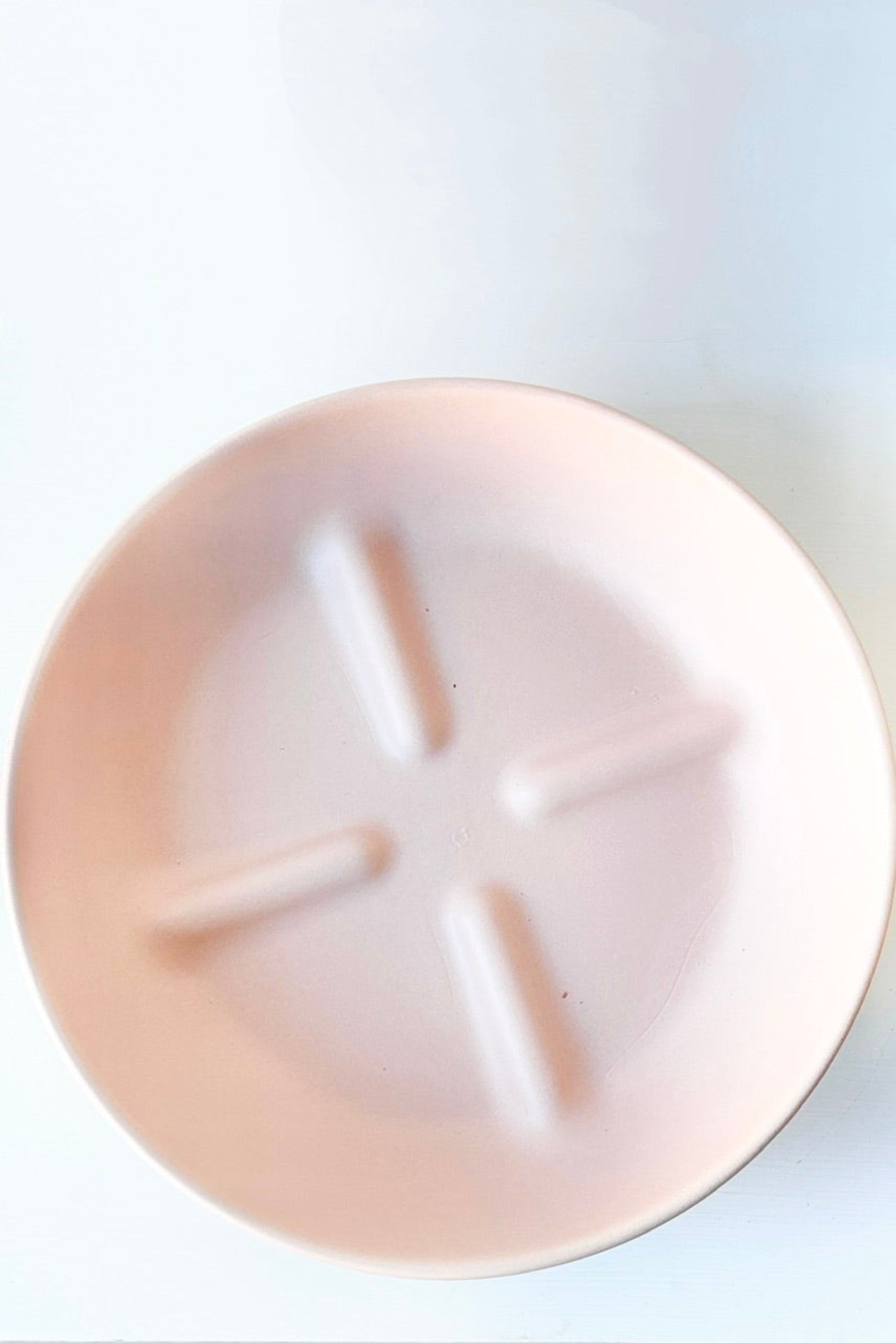 Dalton pink ceramic saucer against a white background ©Sprout Home