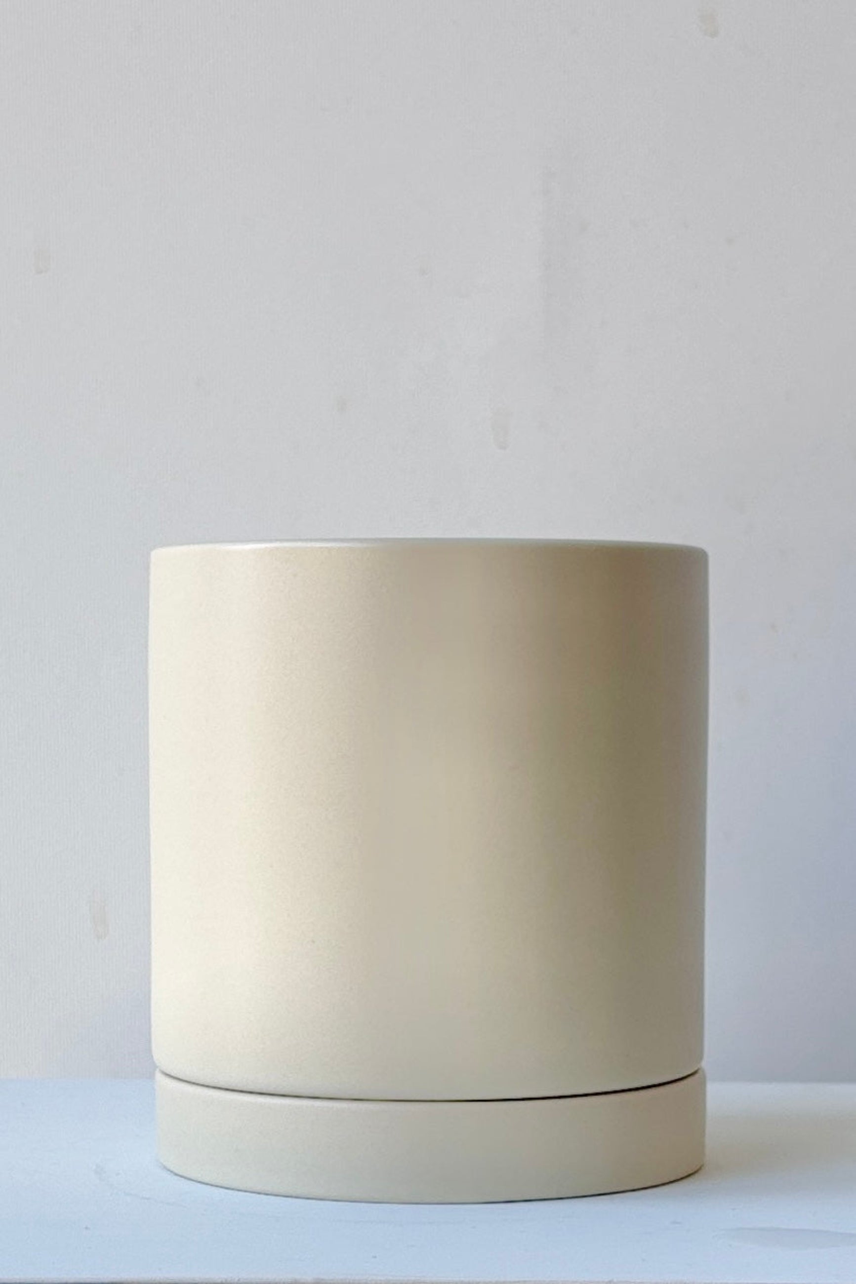 Beige ceramic Romey pot on a white background ©Sprout Home
