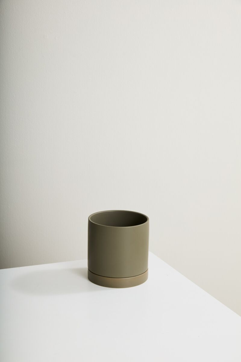 Moss Romey Pot, empty, o a white surface and a gray white backdrop ©Accent Decor
