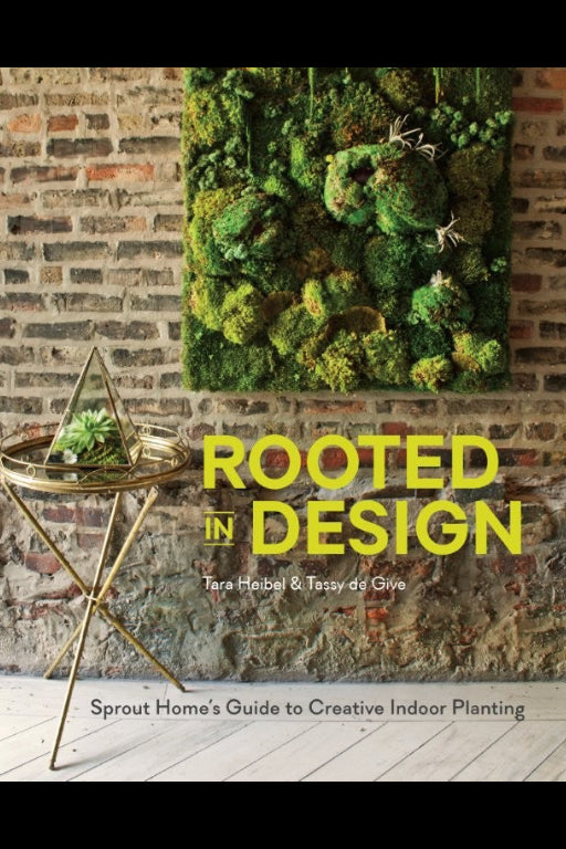 Book cover of 'Rooted in Design' with a moss wall and side table in the background. ©Penguin Random House