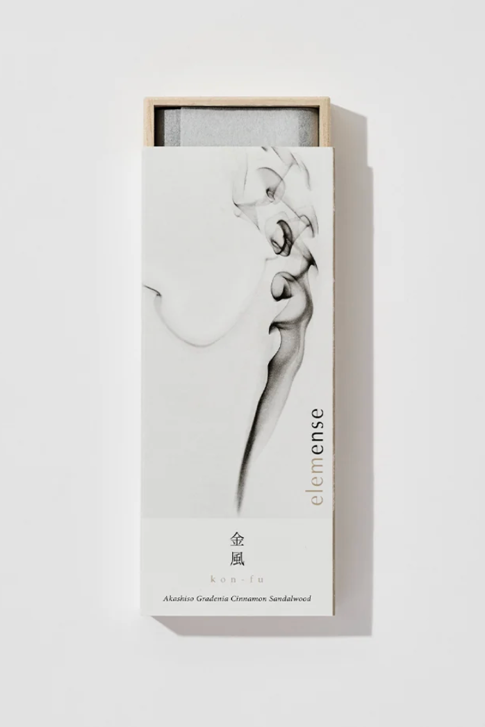 White box of incense with a smoke pattern printed in a white room ©Nippon Kodo
