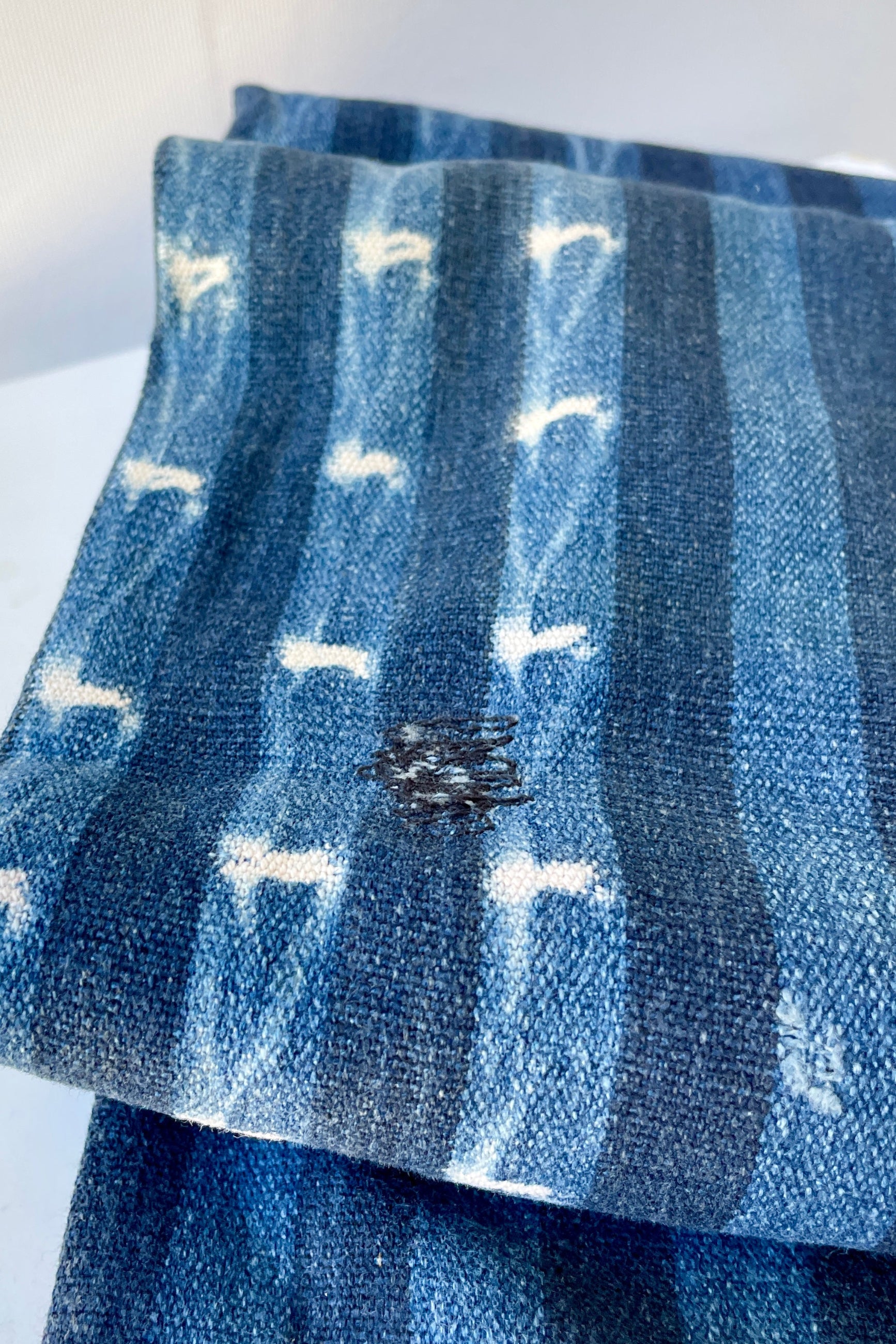 Indigo Tie-dye mud cloth showing some its natural imperfections. ©Sprout Home