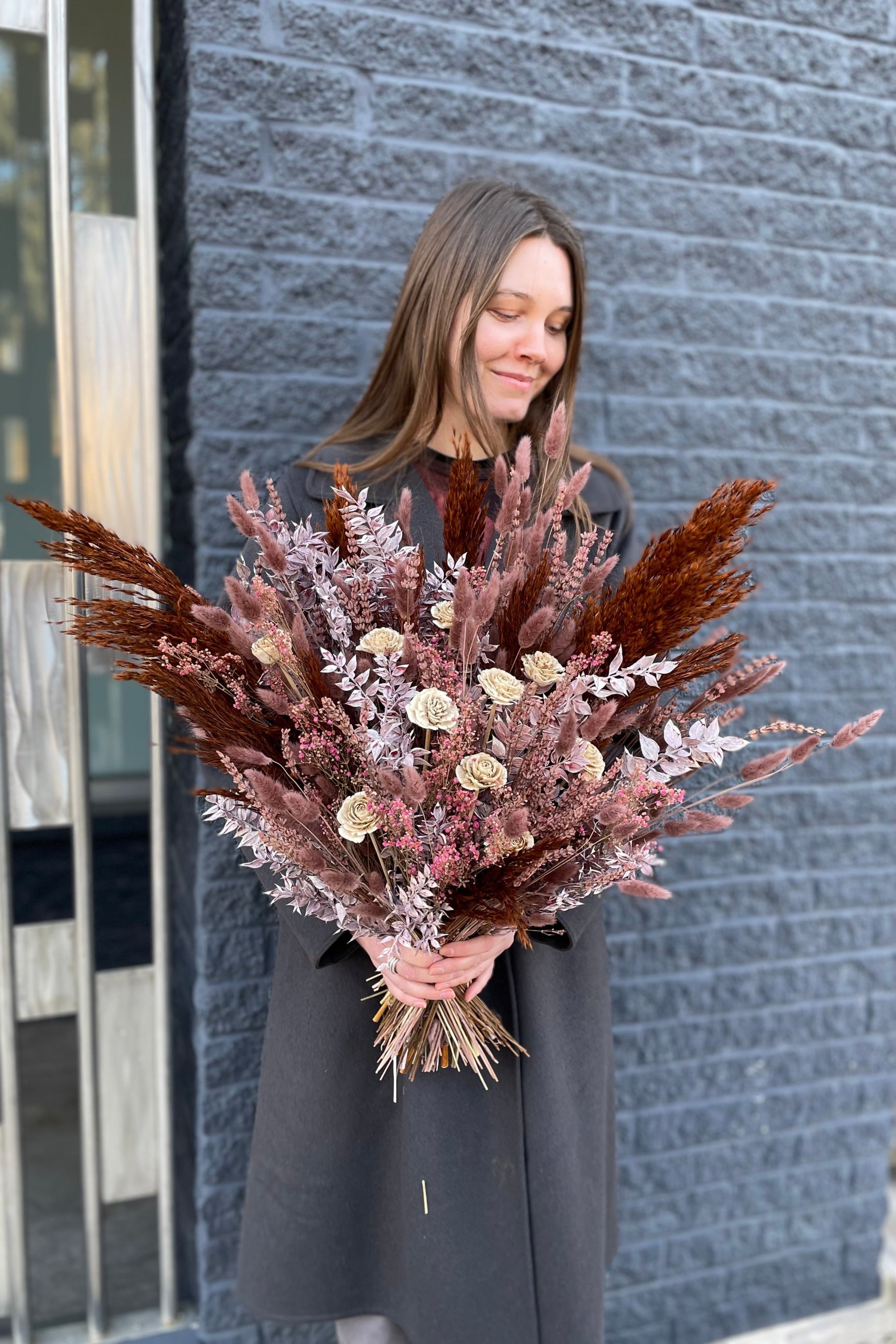Ambrosia preserved Floral arrangement by Sprout Home in shades of plum, brown, gray and ivory being held in hand ©Sprout Home #size_PLP