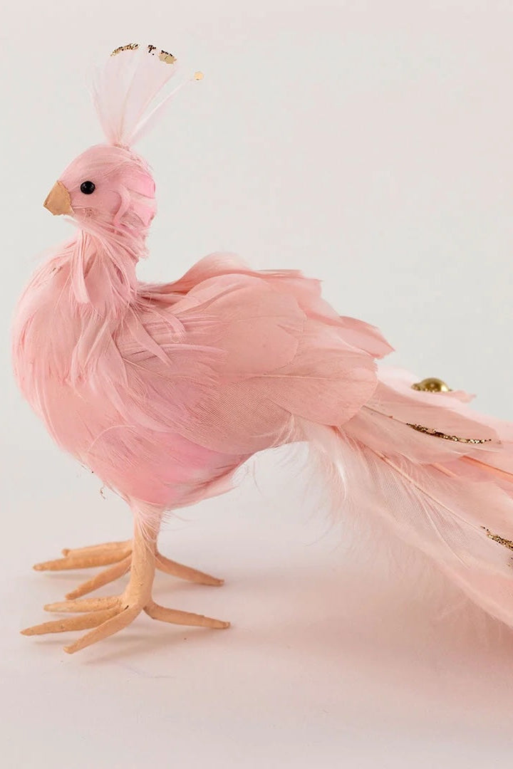 A decorative pink bird ornament with gold accents on a white background ©Zucker Feather Products