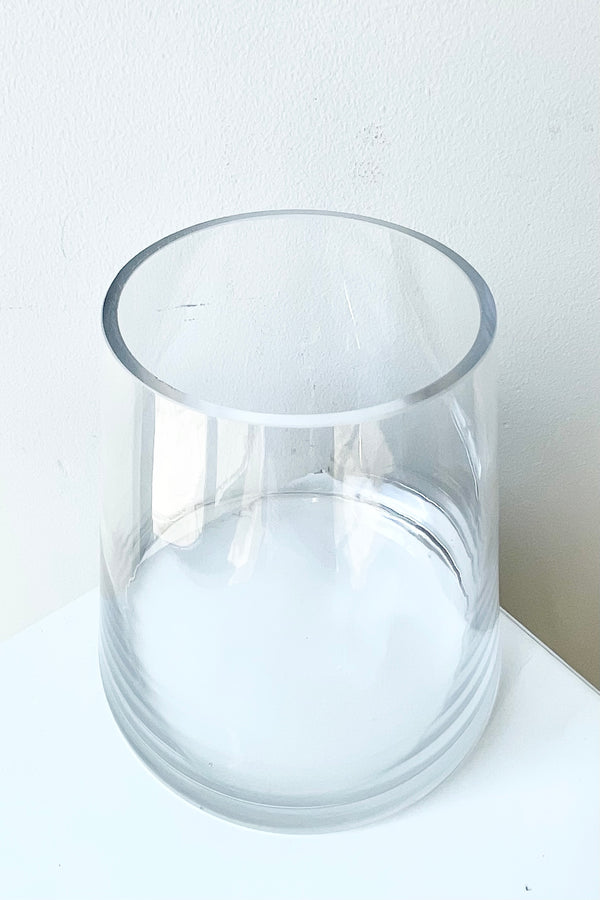 Clear glass round reverse vase 5.5 high looking from the above side.