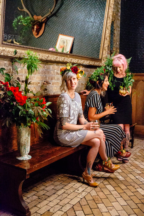 Girl's Night Out floral by Sprout Home. Floral crowns and floral anklets part of other floral. Hip bar scene. Photographed by Heather Talbert.
