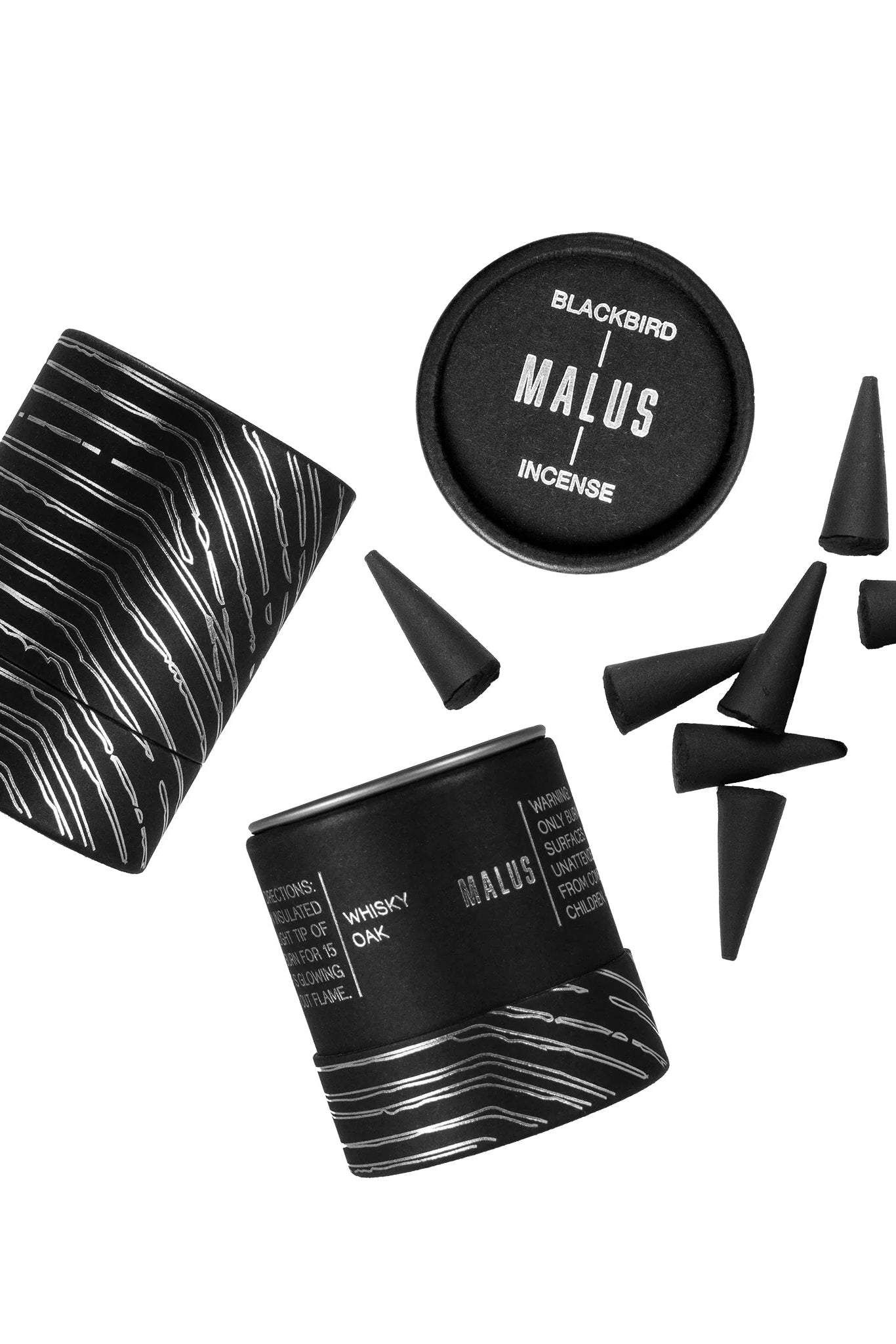 Blackbird Malus incense spilling outside of its cannister ©Blackbird