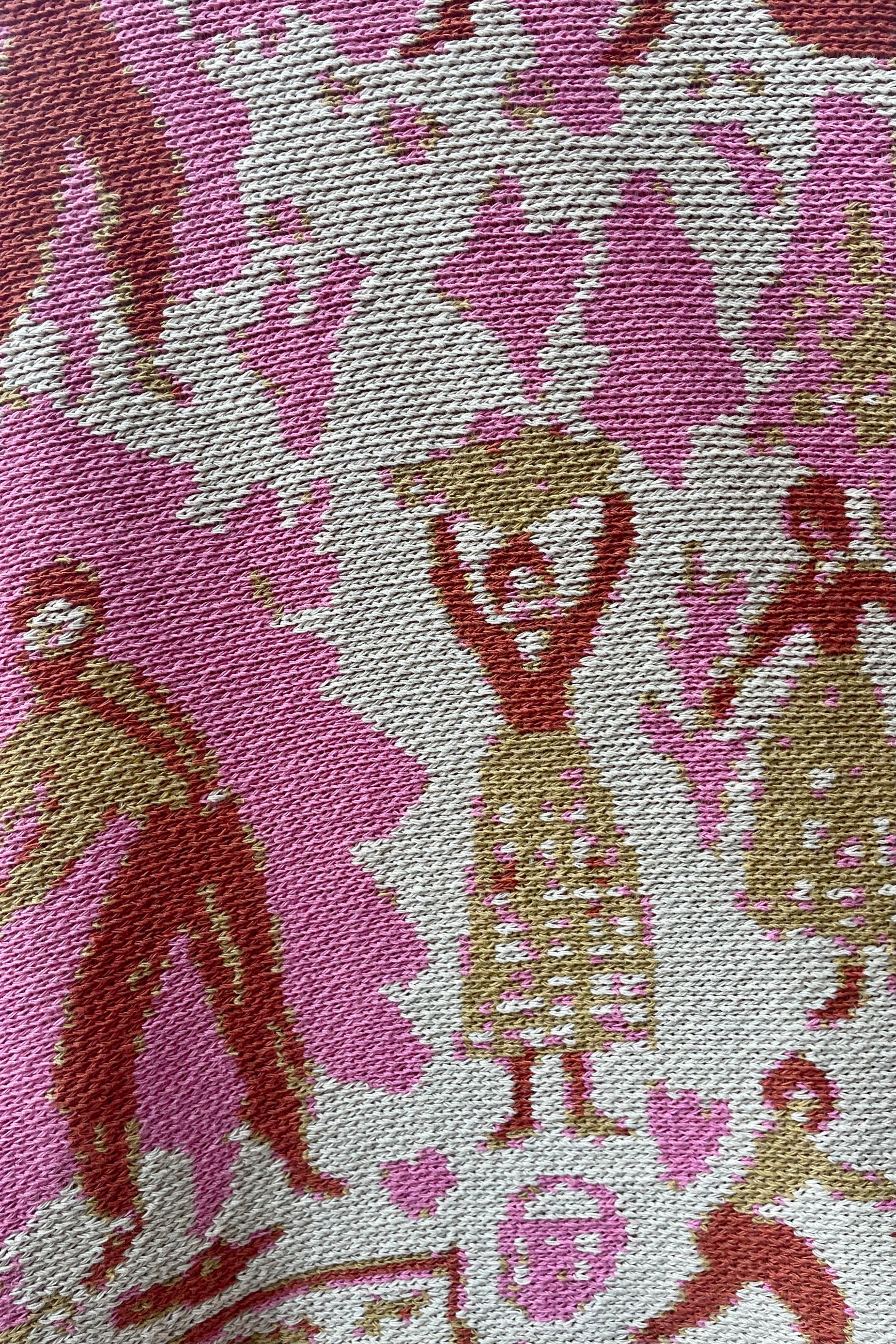 Close up photo of weave and color detail of Swiss Fields Pattern blanket ©Sprout Home