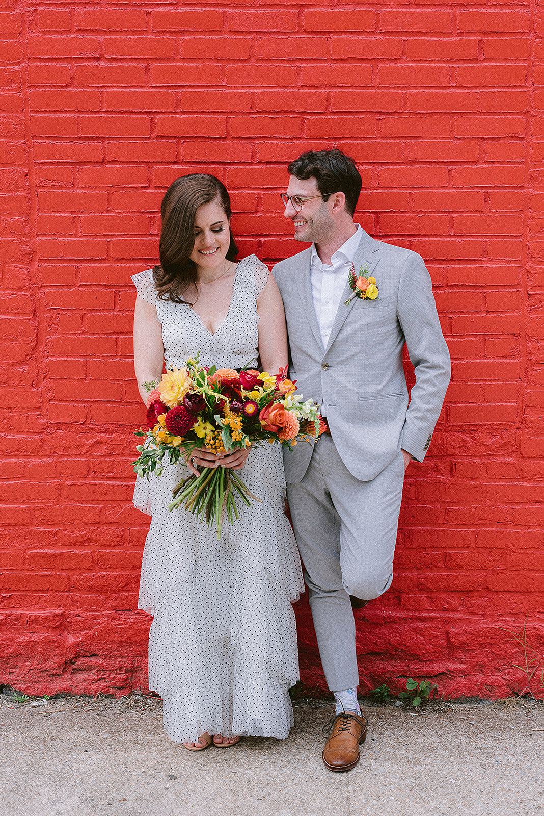 Sprout Home wedding bouquet and boutonniere in warm tones for Cait & Will. Photograph by Hannah Jan Photo.