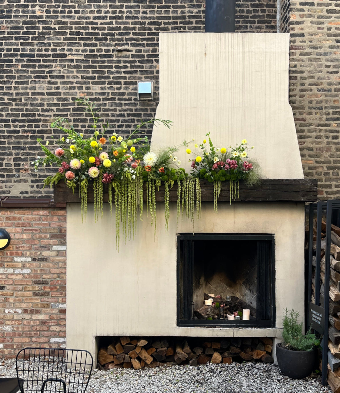 Floral installation by SPROUT HOME on the fireplace outside at Elske Restaurant in Chicago. Photo by Sprout Home