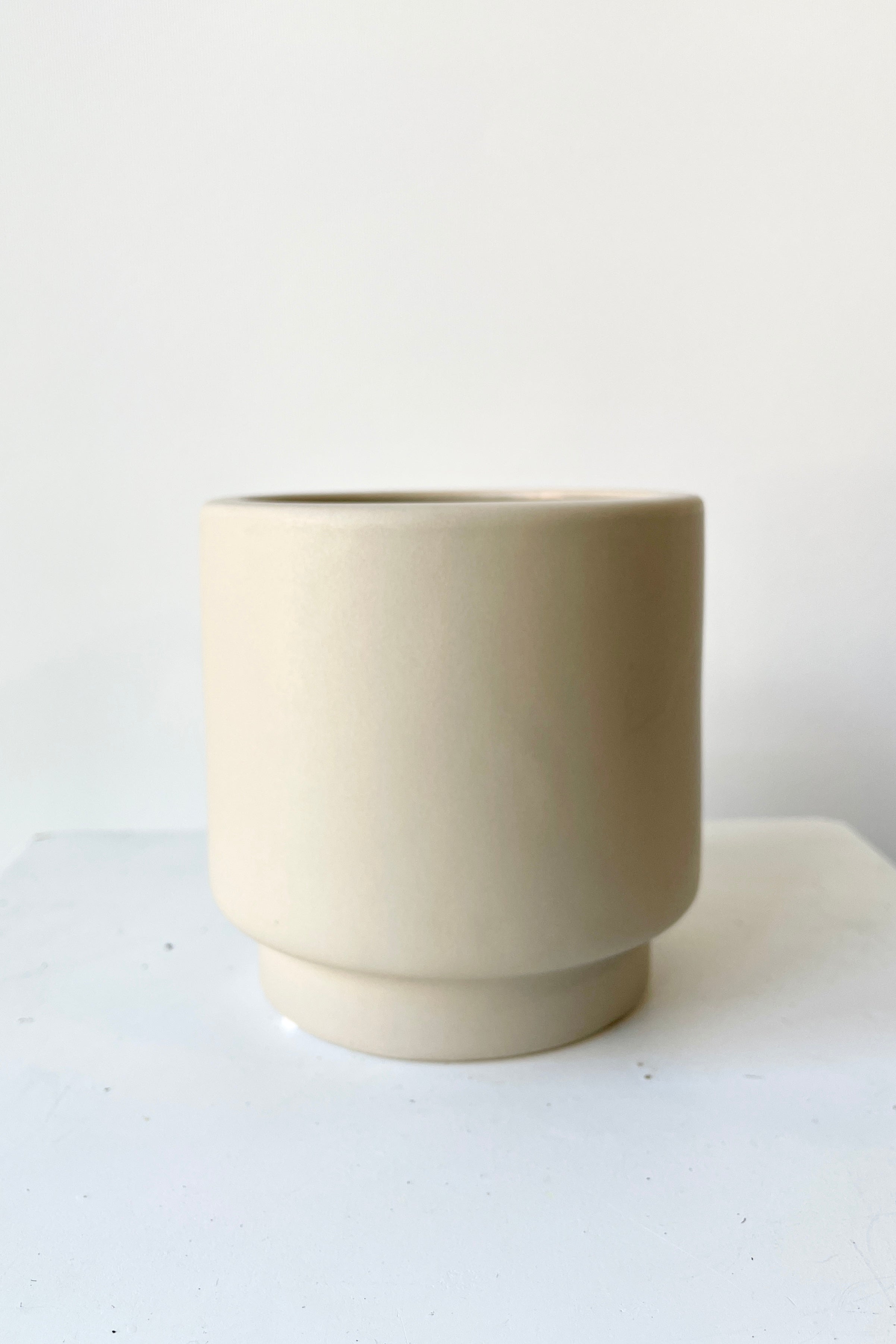 Solid Small Mole Pot against a white background viewed at eye level.