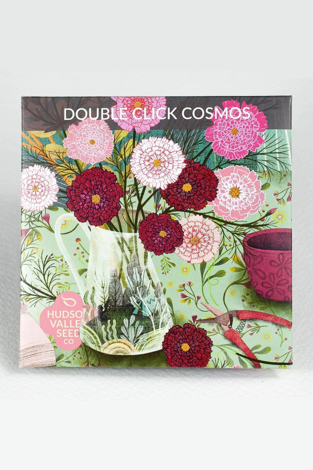 Seed packet with floral design and 'Double Click Cosmos' text on a gray background ©Hudson Valley Seed Co.