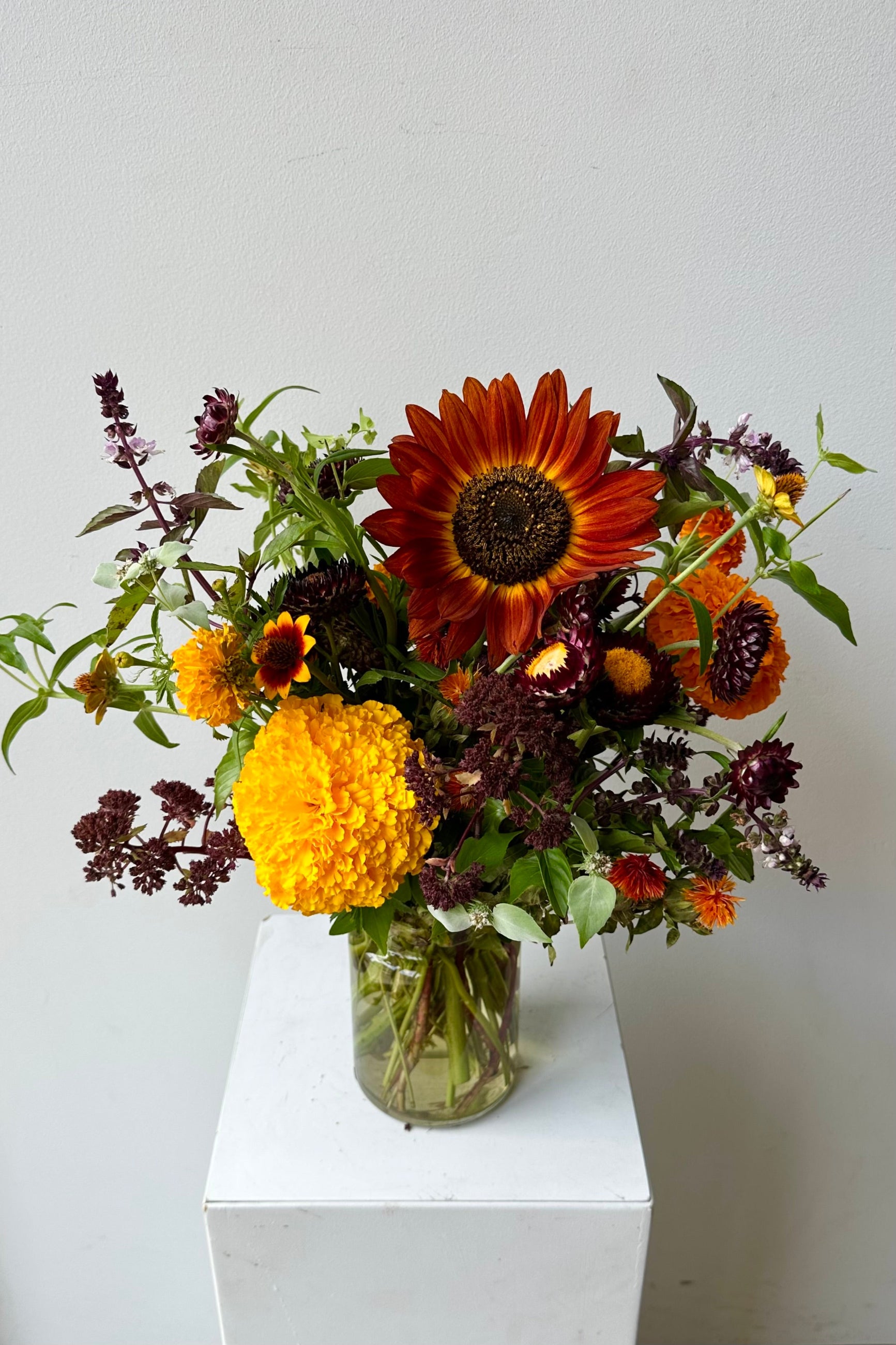 Earth custom fresh floral arrangement by Sprout Home featuring sunflower and marigold in August #size_$75