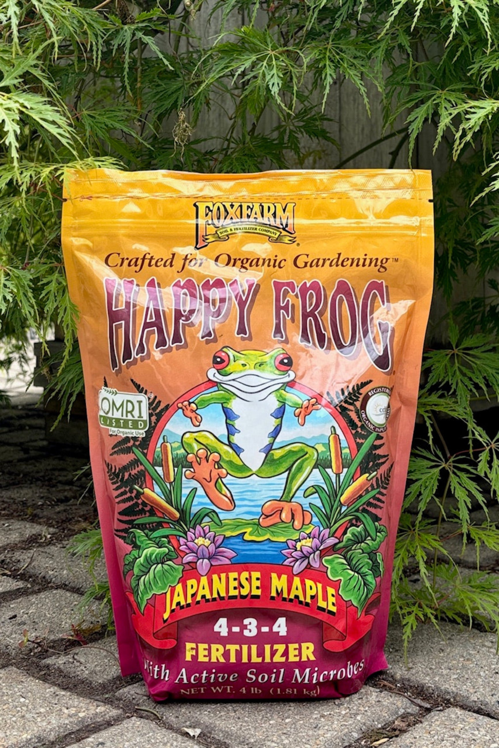 Happy Frog Japanese Maple fertilizer in a 4 pound bag displayed in a garden ©Sprout Home