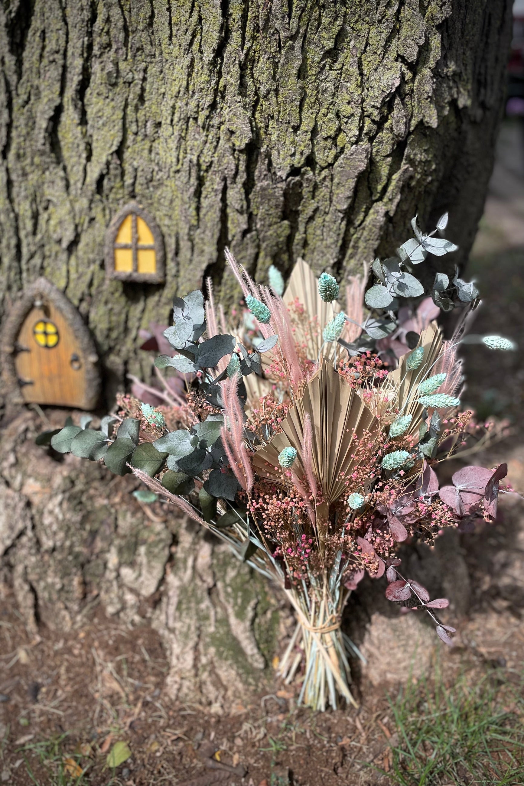 Sprout Home custom preserved arrangement 'Faerie' sitting against a tree. ©Sprout Home #size_$125