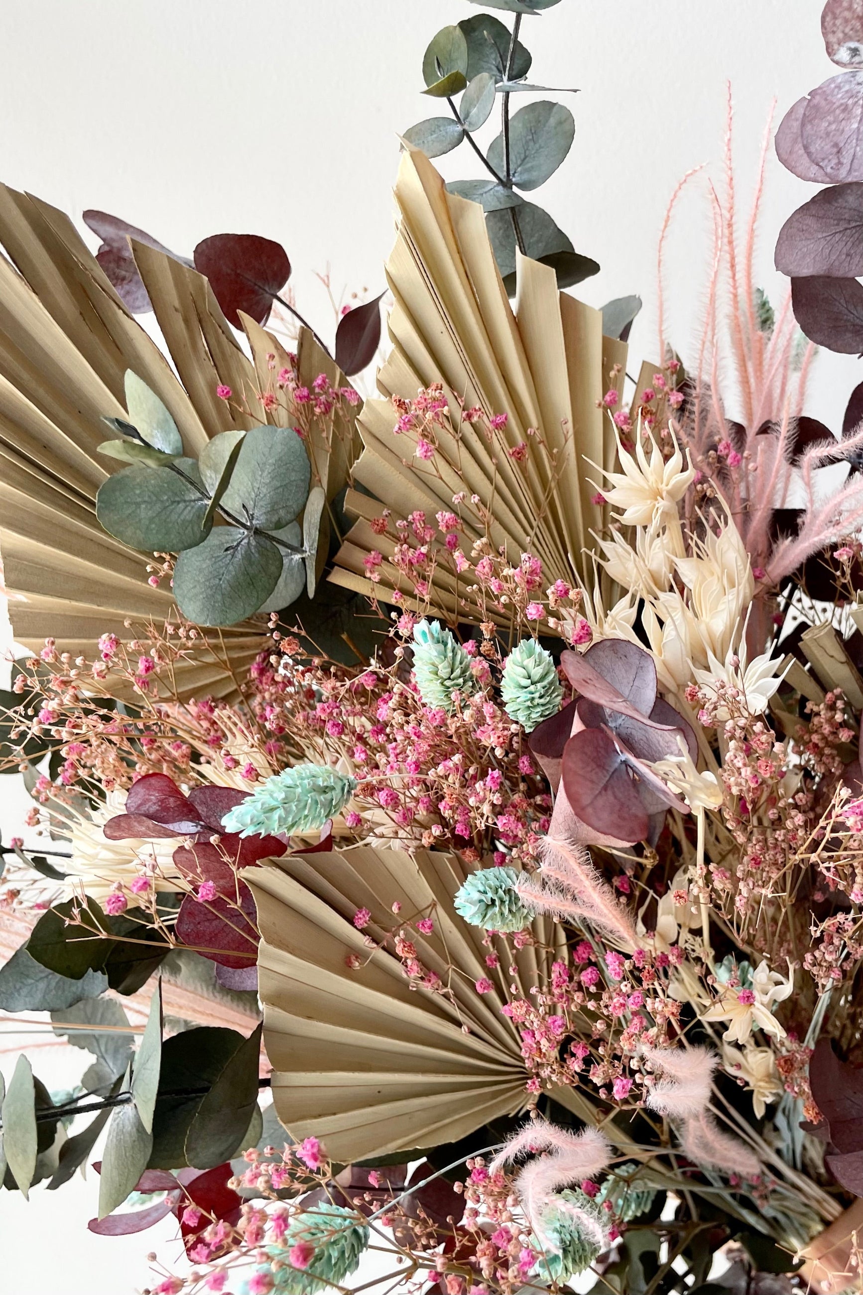 Faerie dried floral arrangement by Sprout Home up close showing the intricacies of the virus preserved pieces in shades of pink, beige and blue ©Sprout Home #size_$125