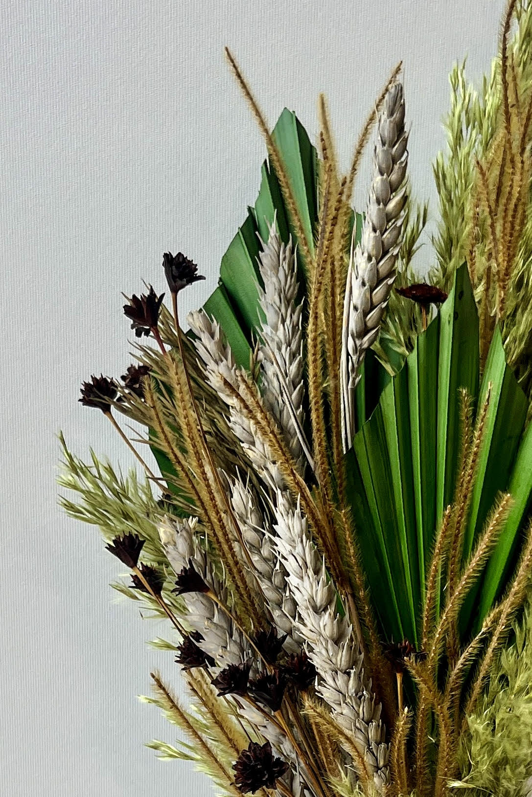 A detail shot of the green preserved floral material used to create Sprout Home's dried floral arrangement Flora Borealis ©Sprout Home #size_$60