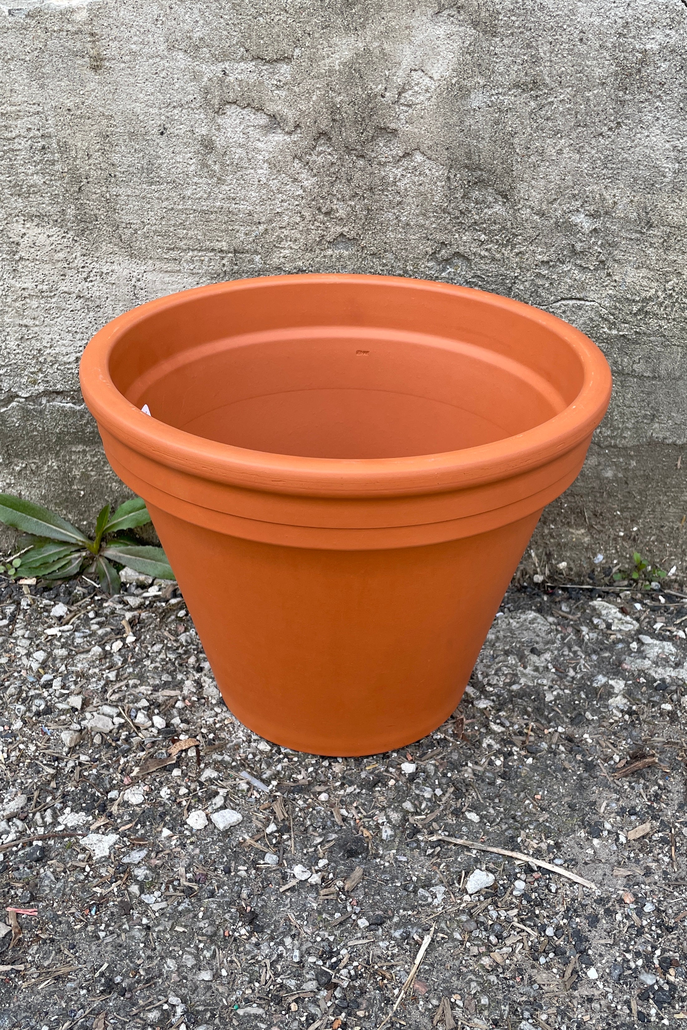 A standard 12" standard clay red pot shown from above and side.