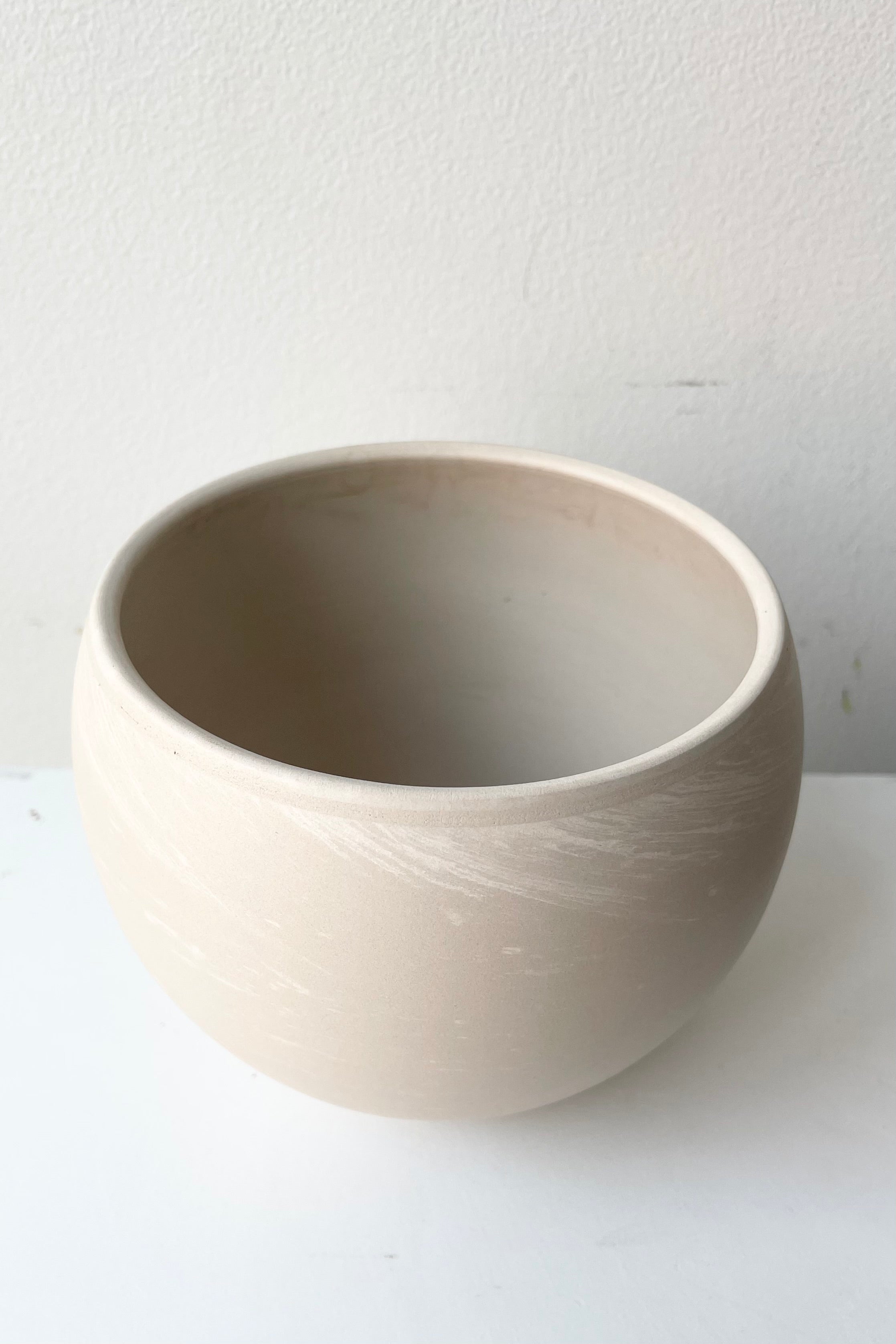 The luna sphere pot viewed from above side on white.