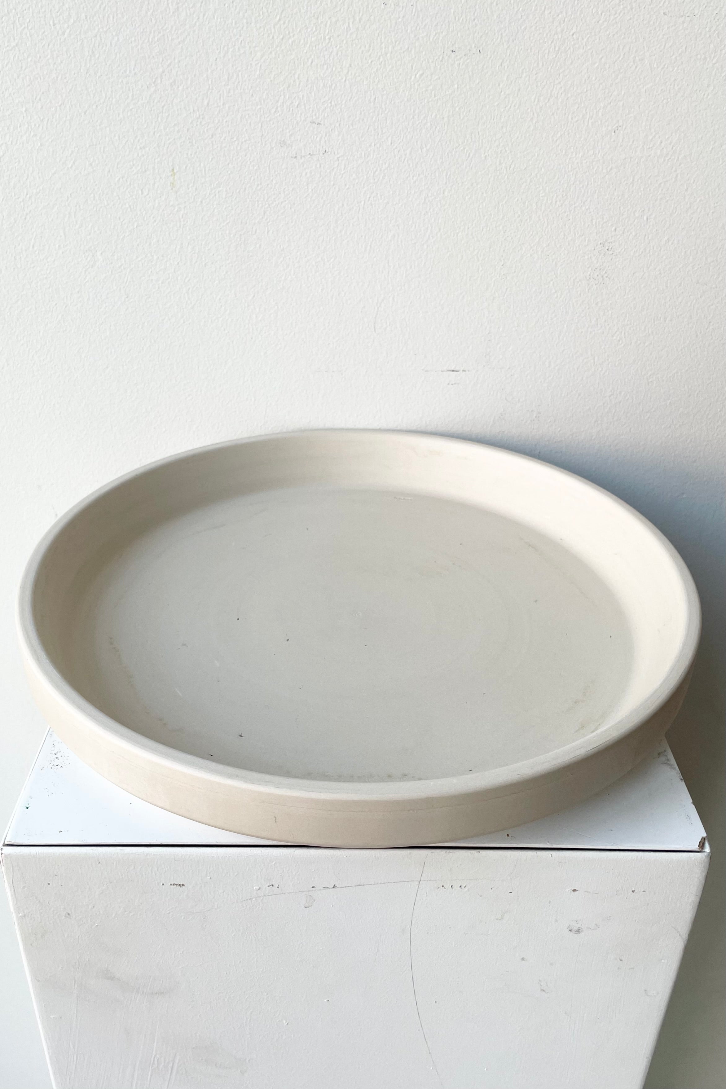 Clay Saucer Granite color to fit a 12" planter viewed from top side.