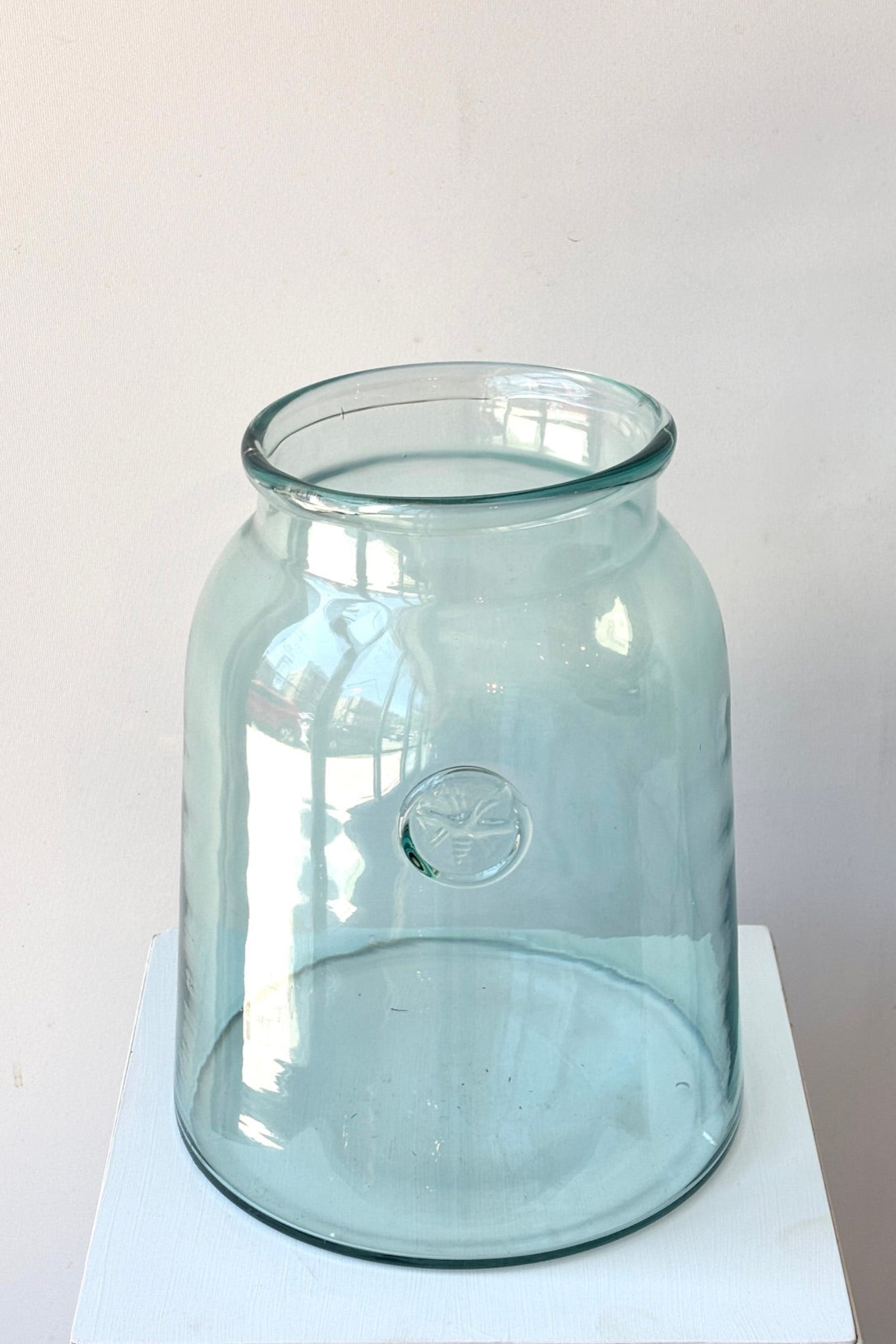 Top view of French Bee Mason Jar Clear with bee stamp against a white background ©Sprout Home