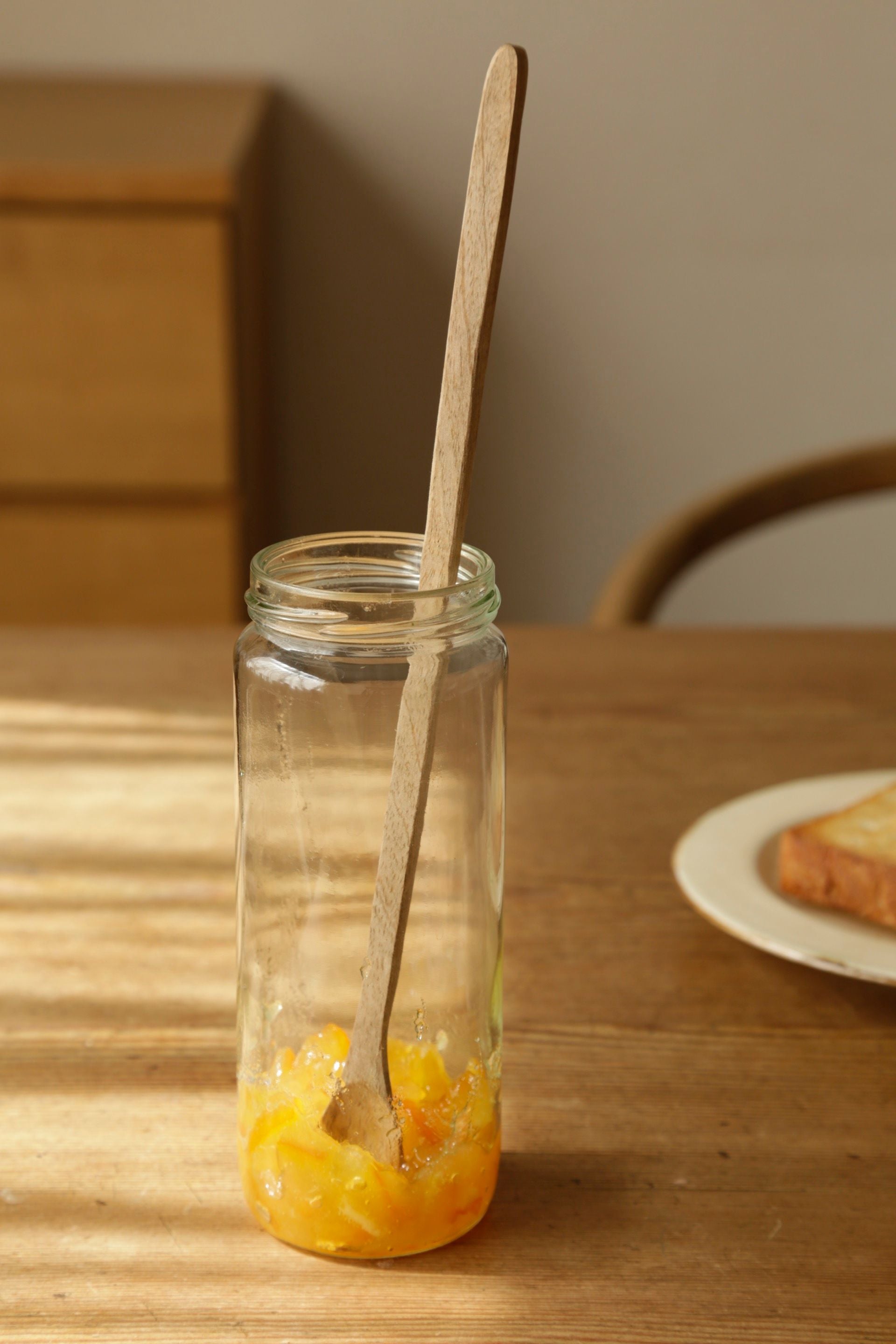 Mango Wood Muddler by Fog Linen Work in a jar of preserves.