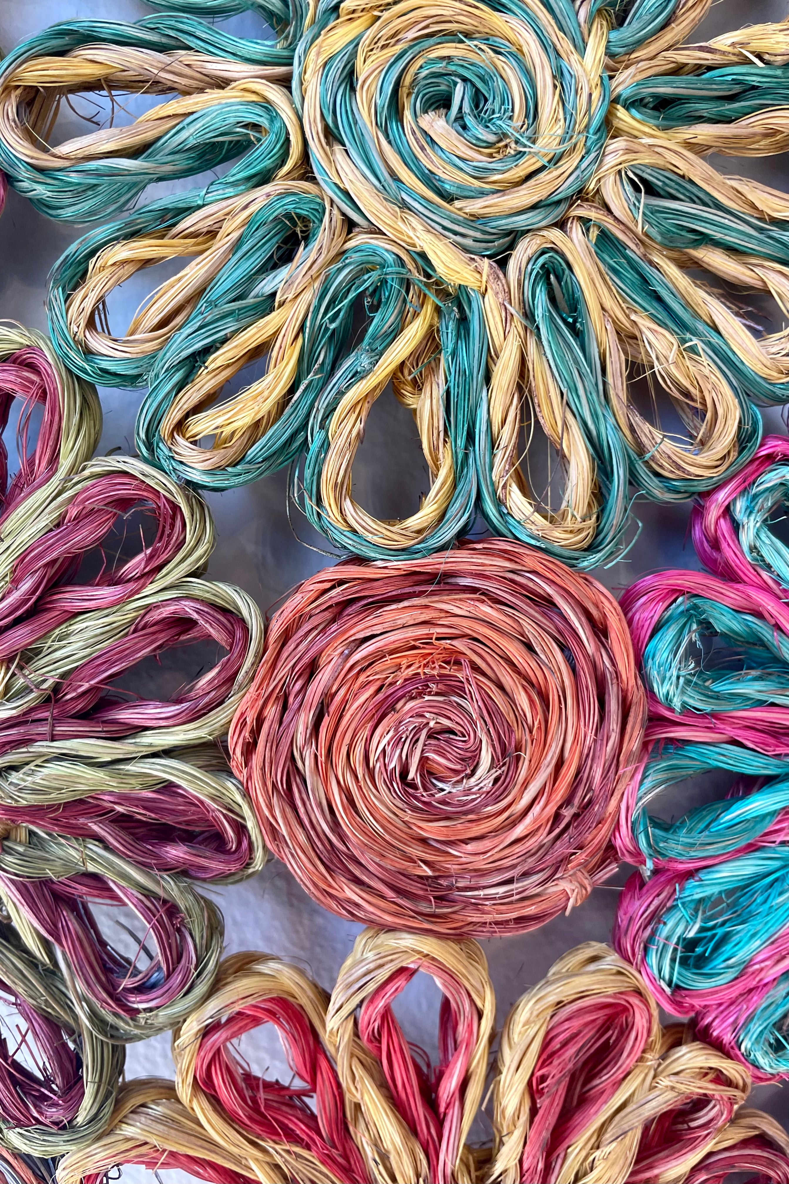 Close detail Photo of a colorful patchwork Daisy pattern Abaca placement