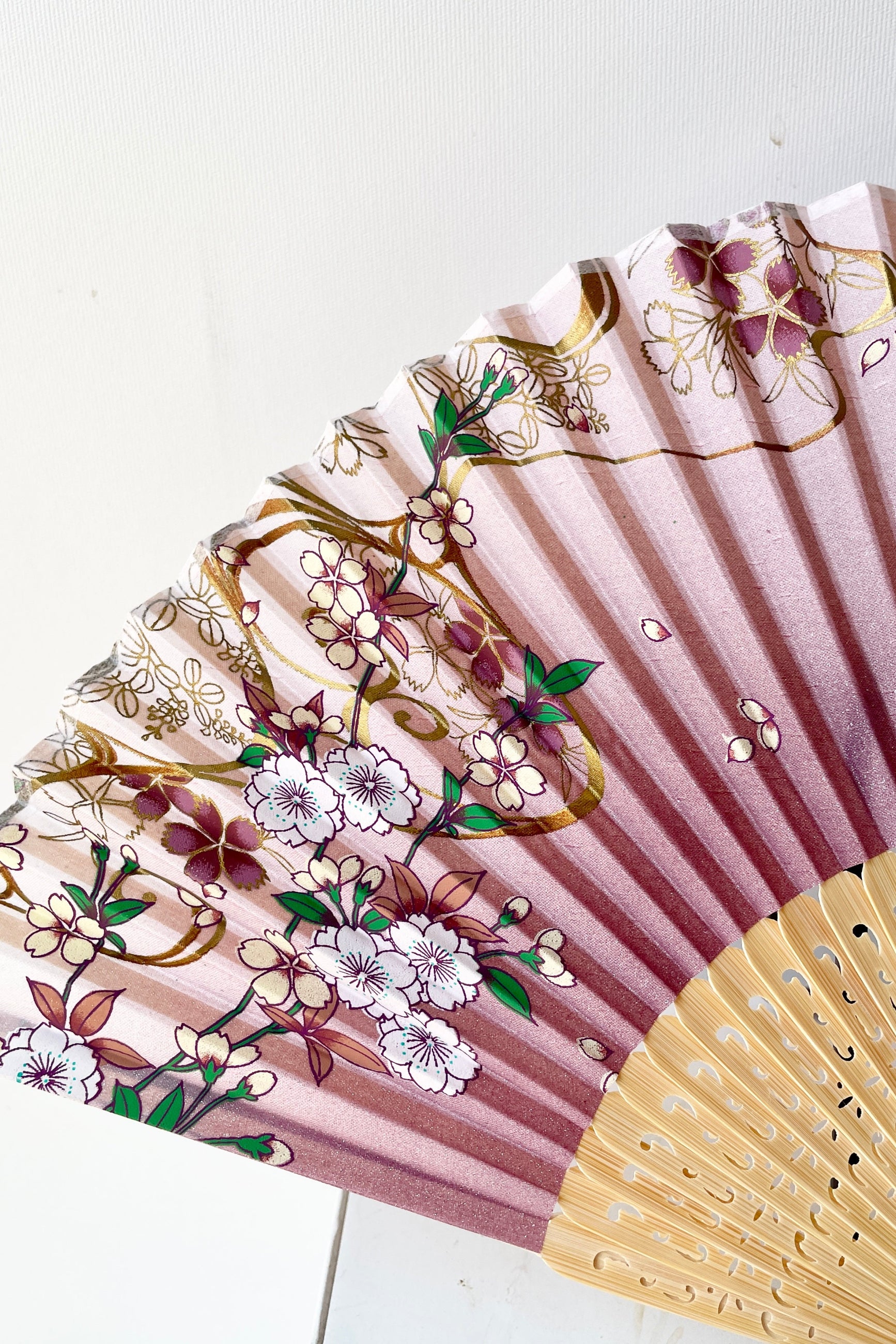 Detail of the Cherry blossom pattern with gold silk fan ©Sprout Home