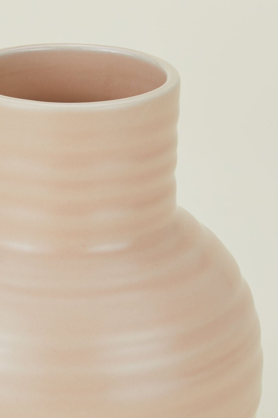 Detail of the Essential blush vase showing the ribbing in the ceramic. by Hawkins New York.